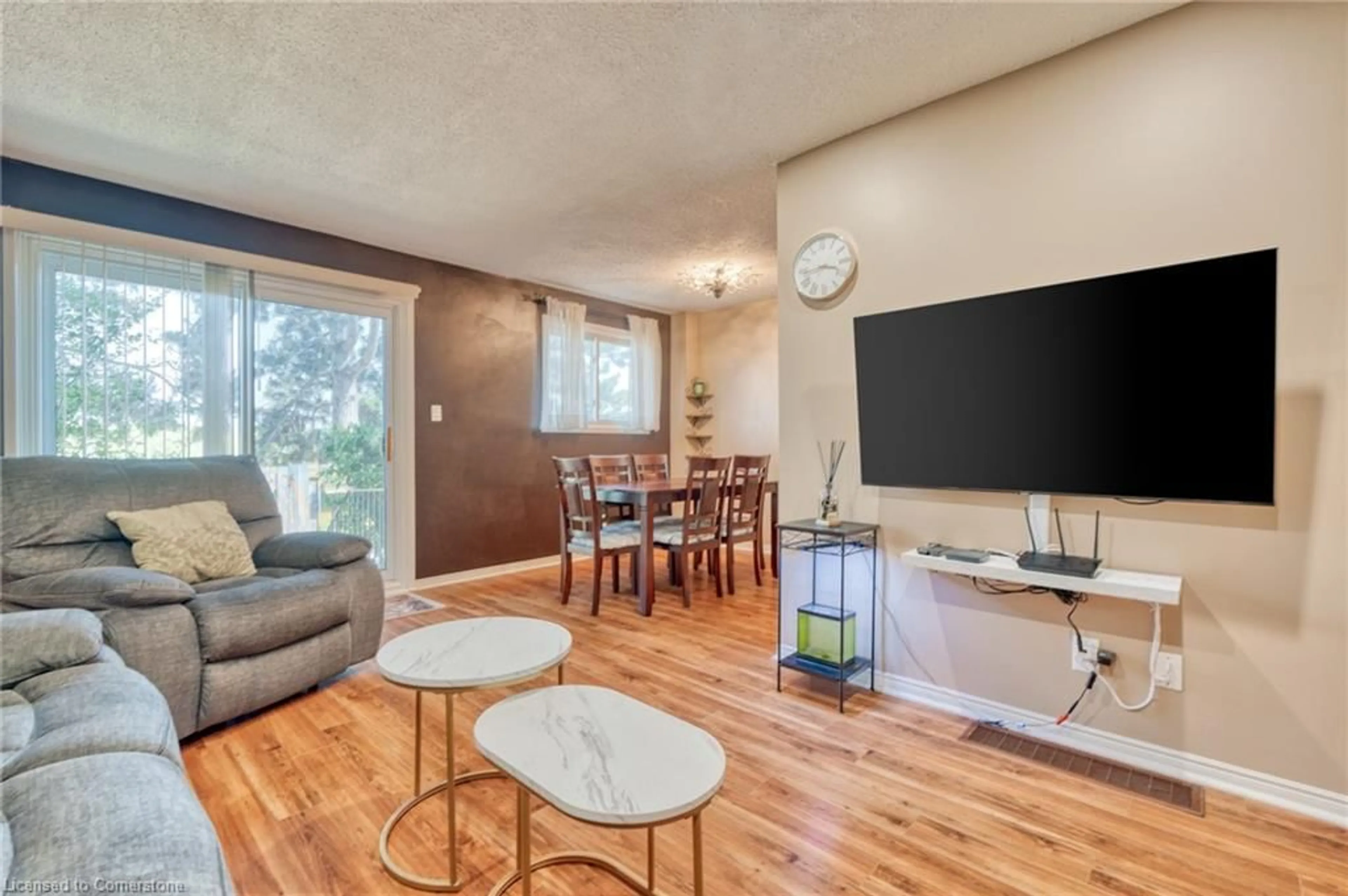 Living room with furniture, wood/laminate floor for 1440 Garth St #55, Hamilton Ontario L9B 1R6