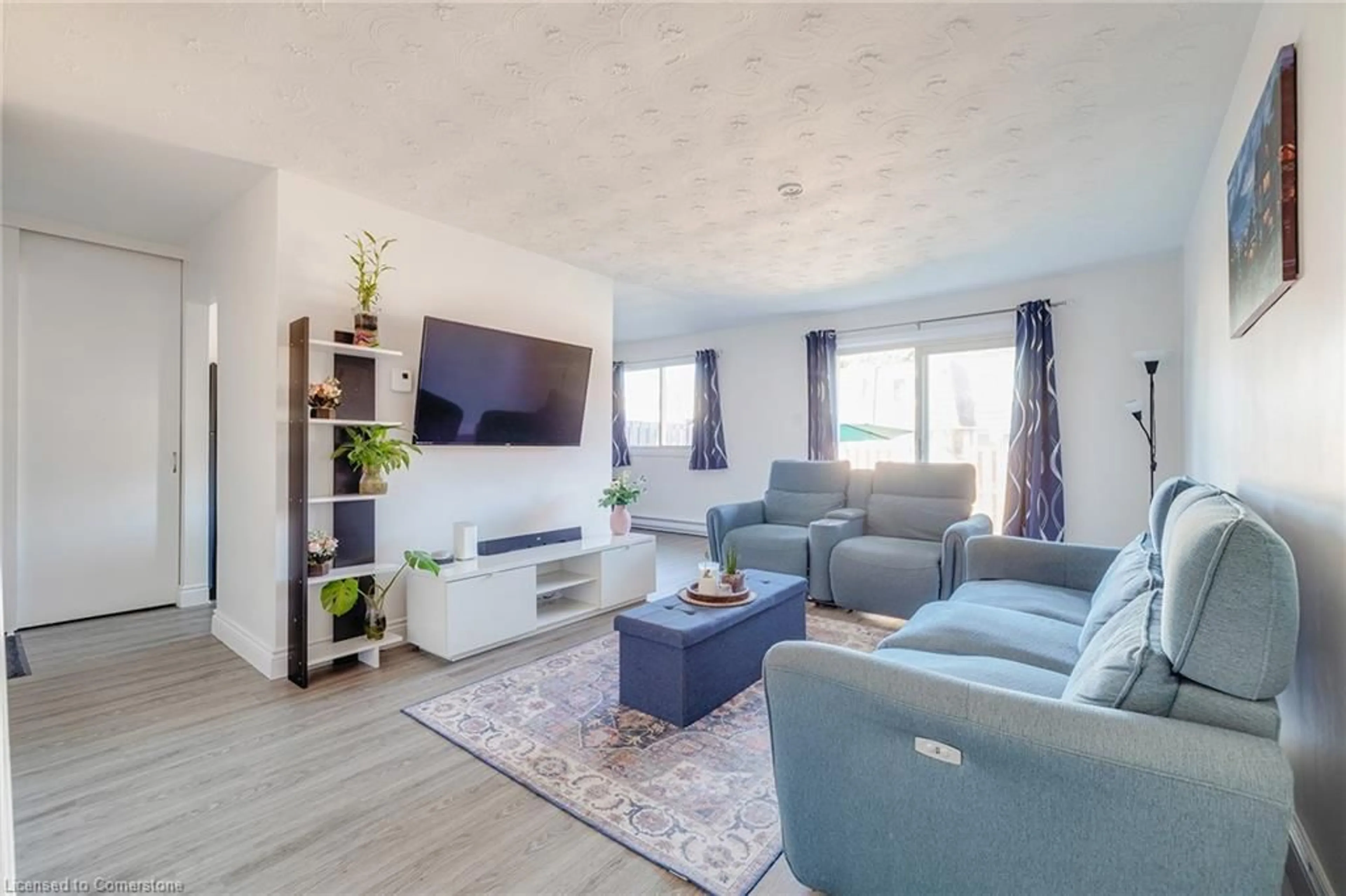 Living room with furniture, wood/laminate floor for 320 Traynor Ave #5, Kitchener Ontario N2C 2J1