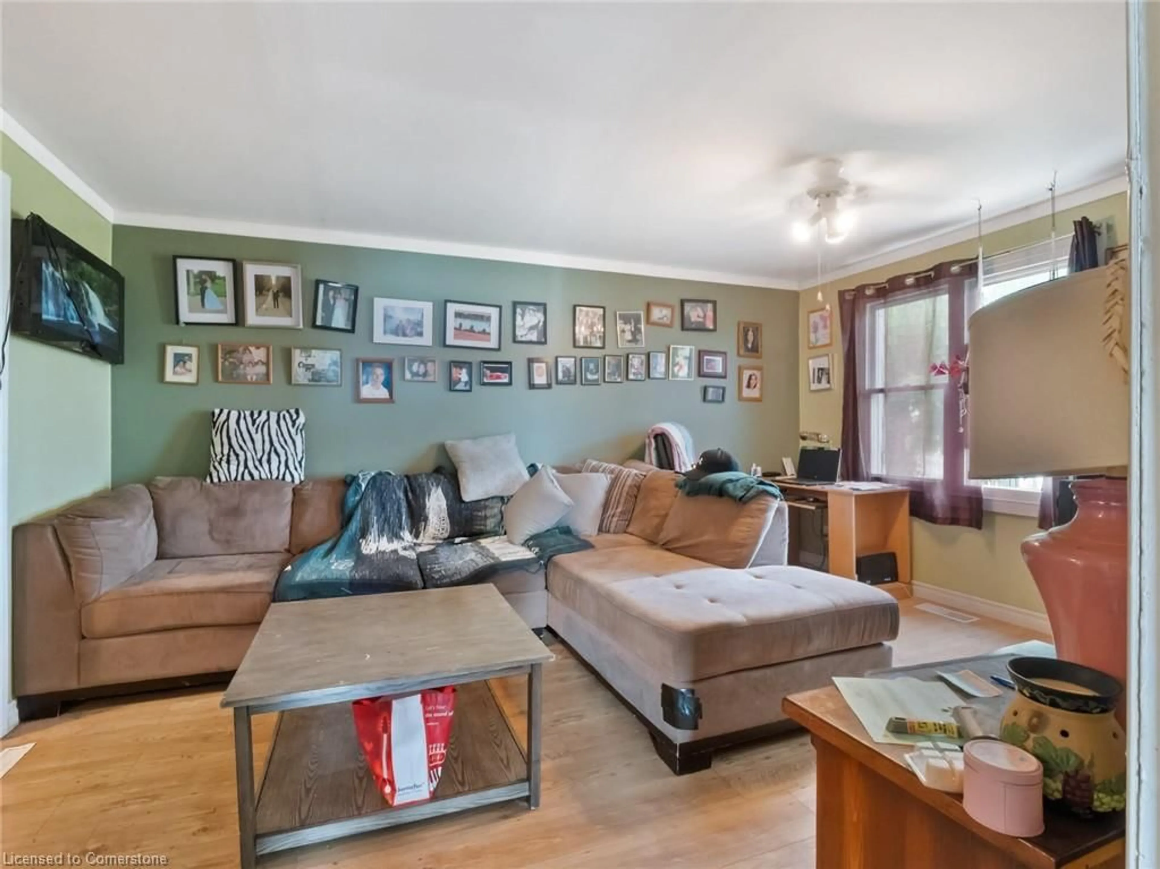 Living room with furniture, wood/laminate floor for 567 Killaly St St, Port Colborne Ontario L3K 2J8