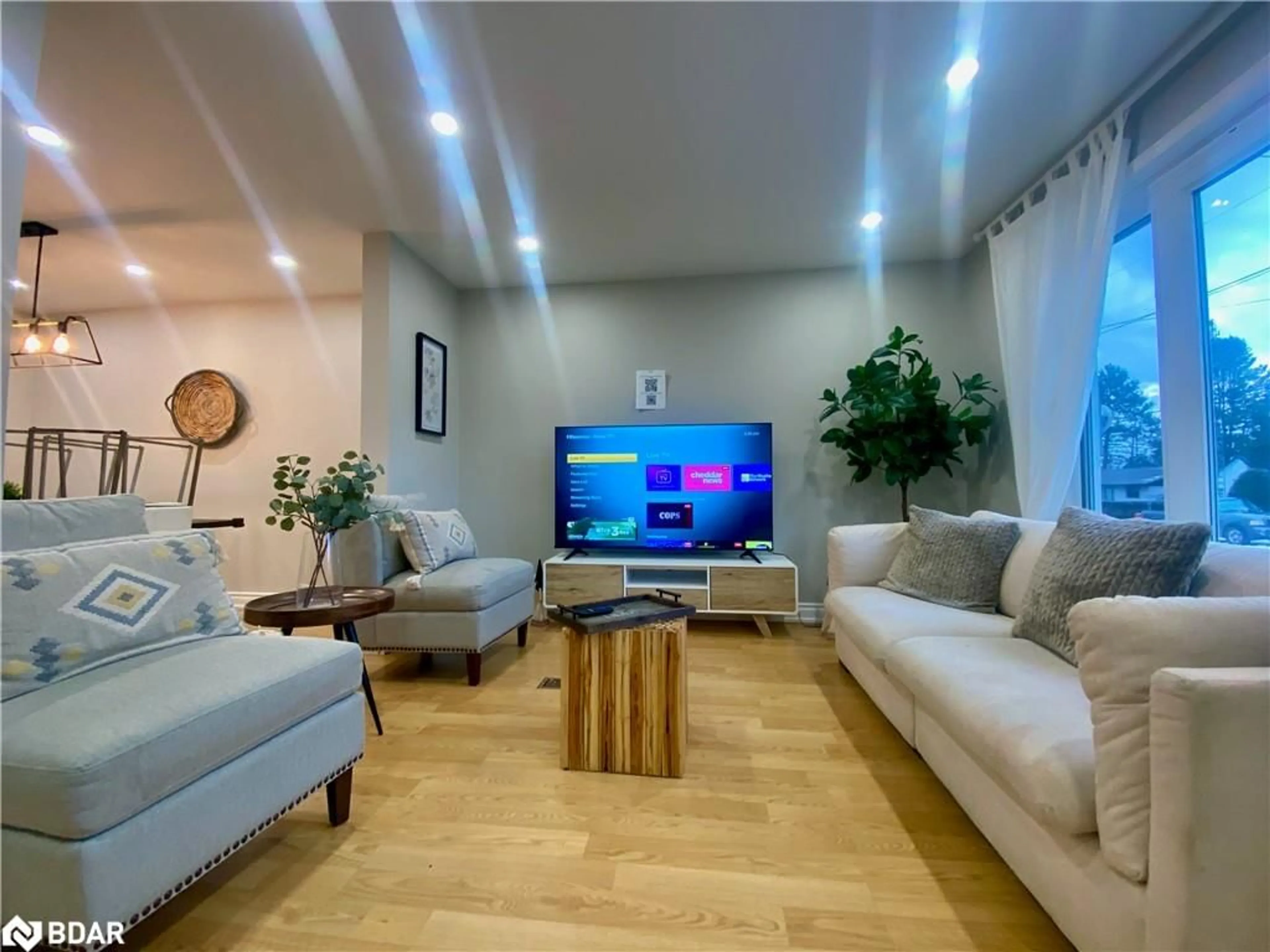 Living room with furniture, wood/laminate floor for 62 Ottawa St, Whitney Ontario K0J 2M0