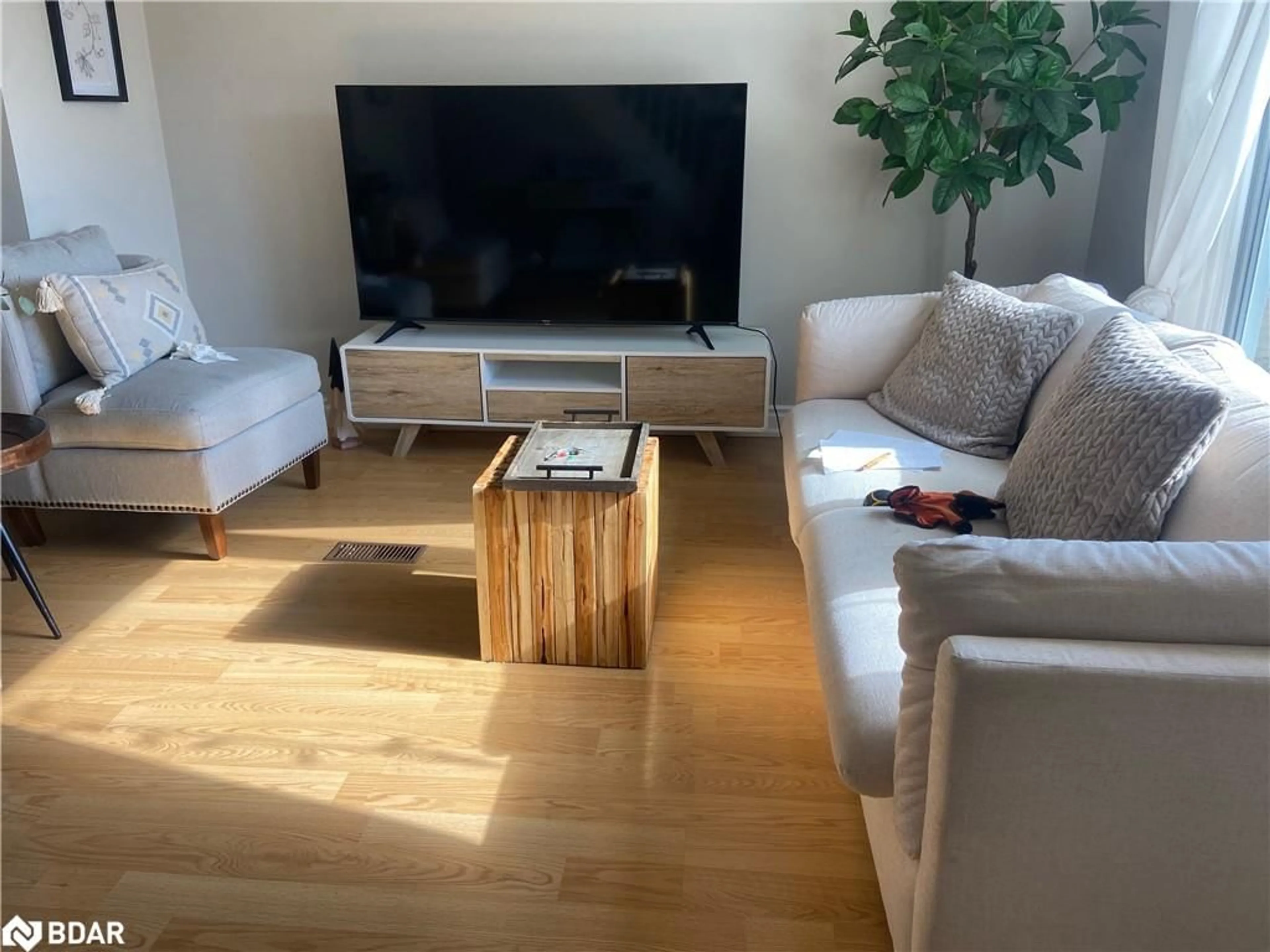 Living room with furniture, wood/laminate floor for 62 Ottawa St, Whitney Ontario K0J 2M0