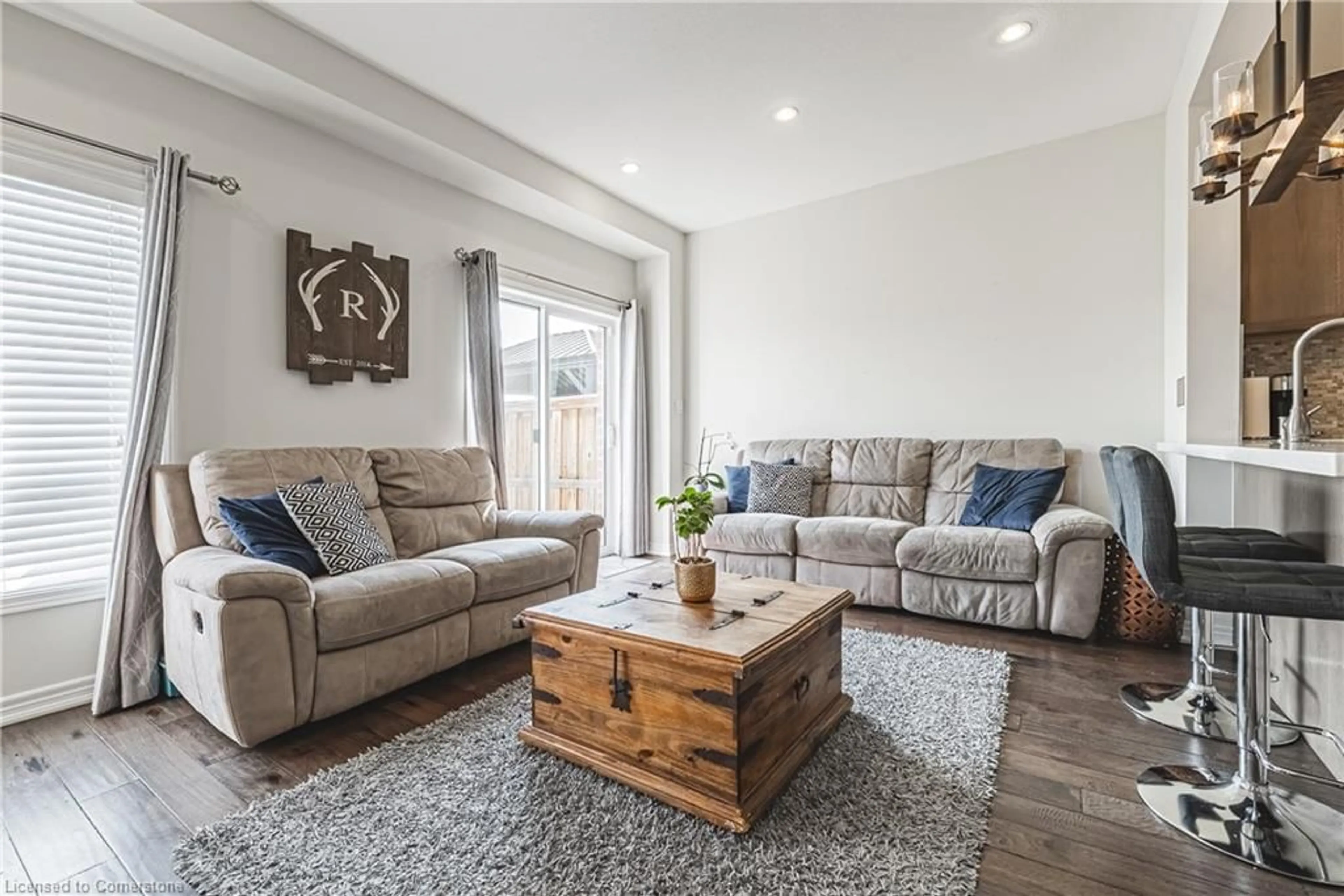 Living room with furniture, wood/laminate floor for 157 Lormont Blvd, Stoney Creek Ontario L8J 0K2