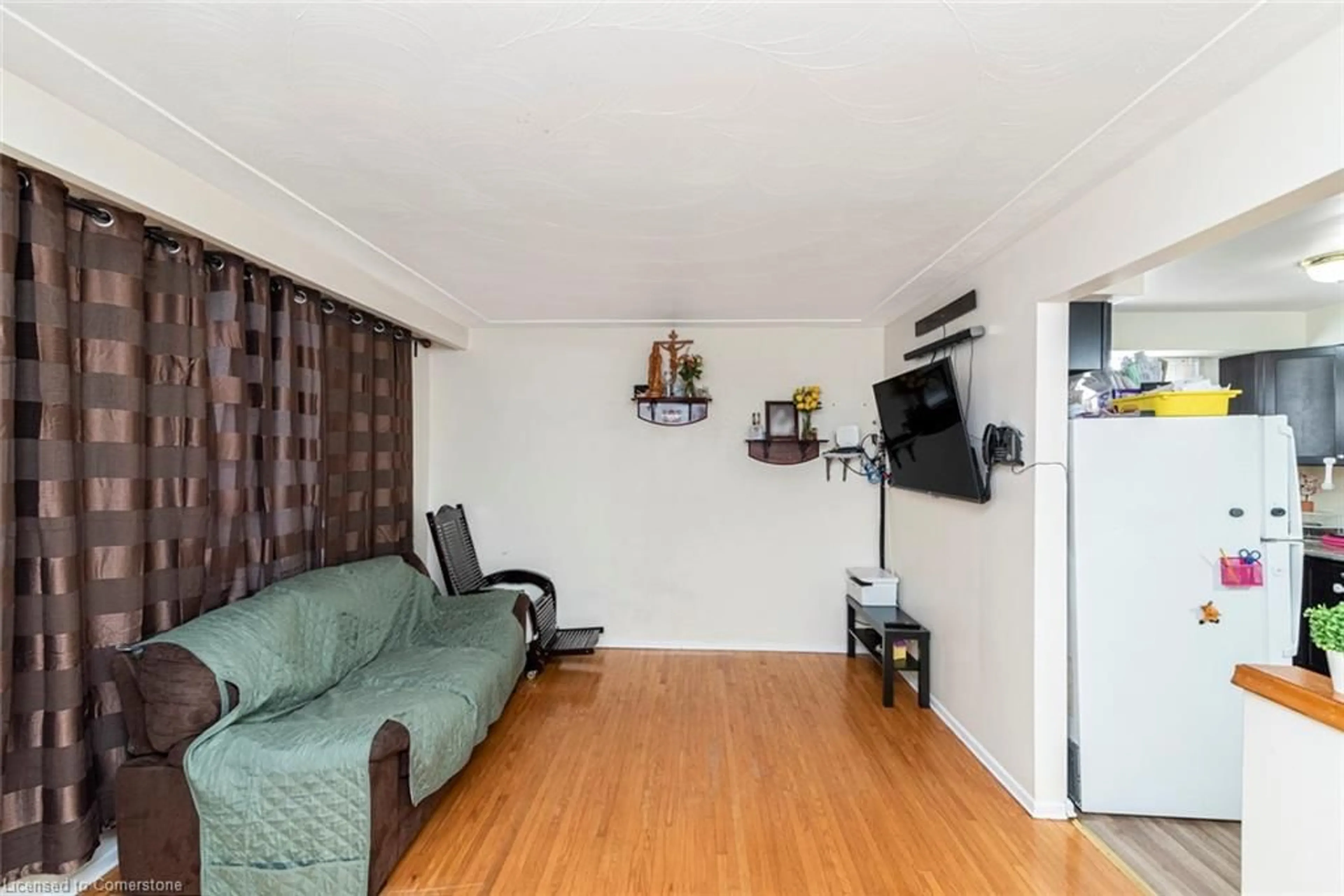 Living room with furniture, wood/laminate floor for 172 Gibson Ave, Hamilton Ontario L8L 6J8