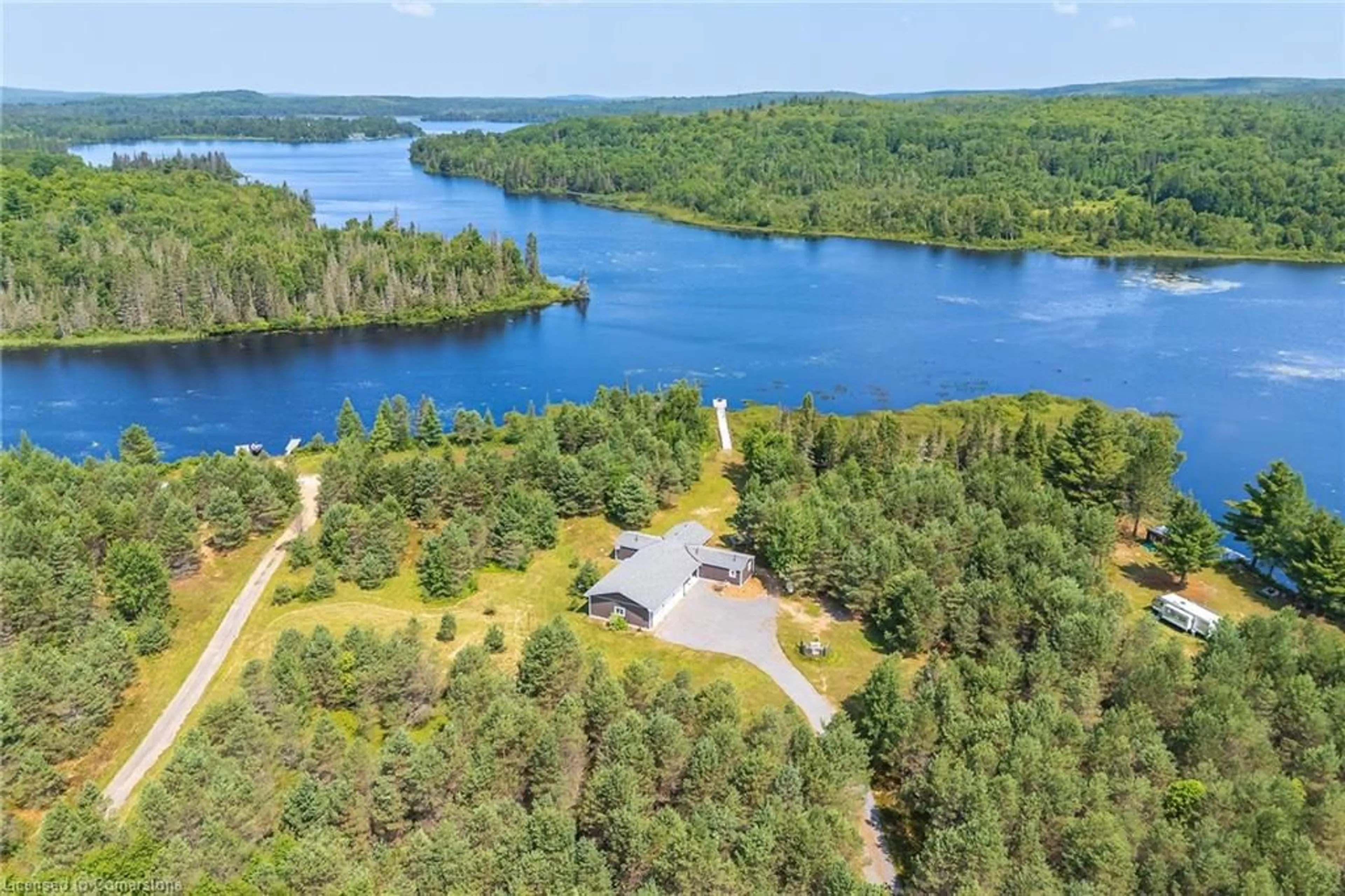 A pic from outside/outdoor area/front of a property/back of a property/a pic from drone, water/lake/river/ocean view for 889 Sandhill Road Rd, Sundridge Ontario P0A 1Z0