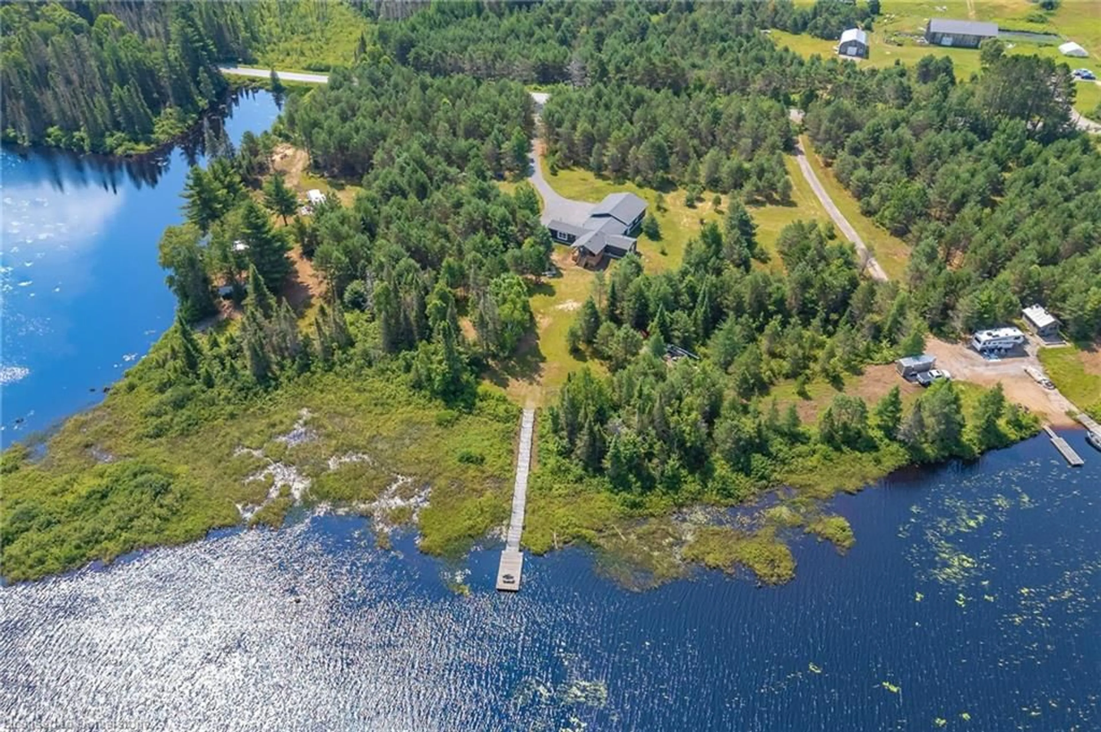 A pic from outside/outdoor area/front of a property/back of a property/a pic from drone, water/lake/river/ocean view for 889 Sandhill Road Rd, Sundridge Ontario P0A 1Z0