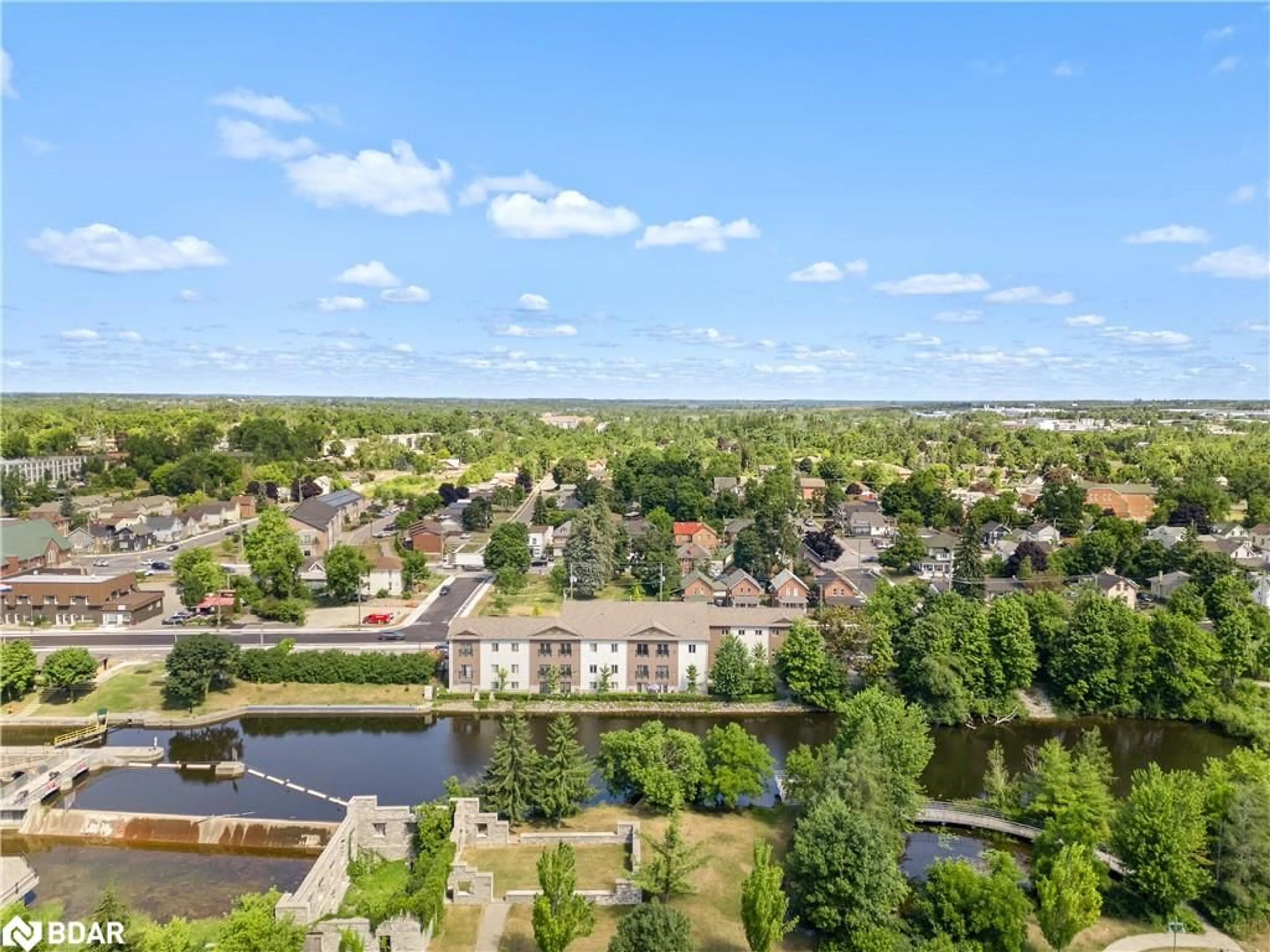 A pic from outside/outdoor area/front of a property/back of a property/a pic from drone, water/lake/river/ocean view for 25 King St #102, Lindsay Ontario K9V 1C4