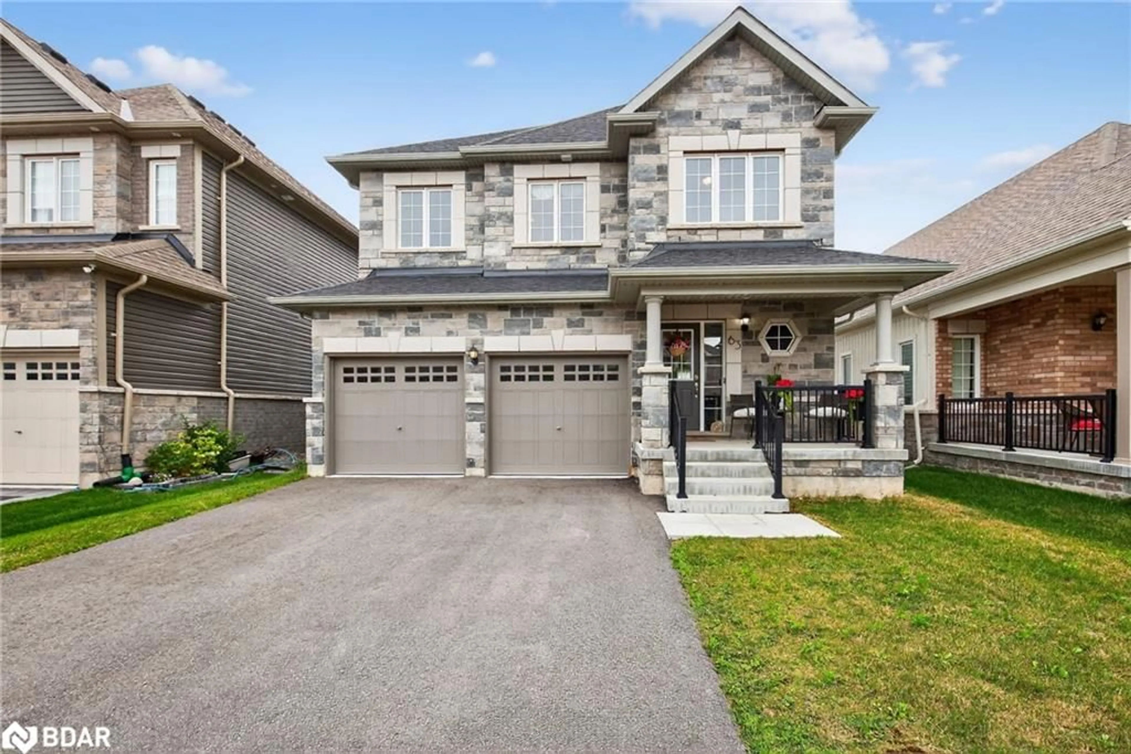 Home with brick exterior material, street for 63 Atlantis Drive Dr, Orillia Ontario L3V 8L4