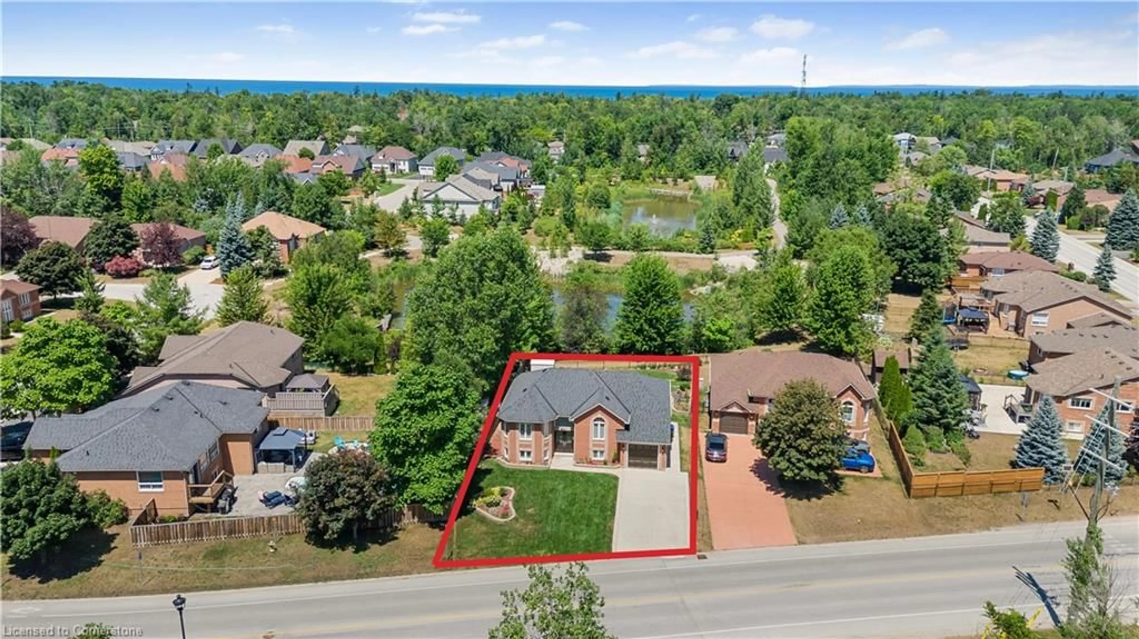 A pic from outside/outdoor area/front of a property/back of a property/a pic from drone, water/lake/river/ocean view for 402 Ramblewood Dr, Wasaga Beach Ontario L9Z 2N9