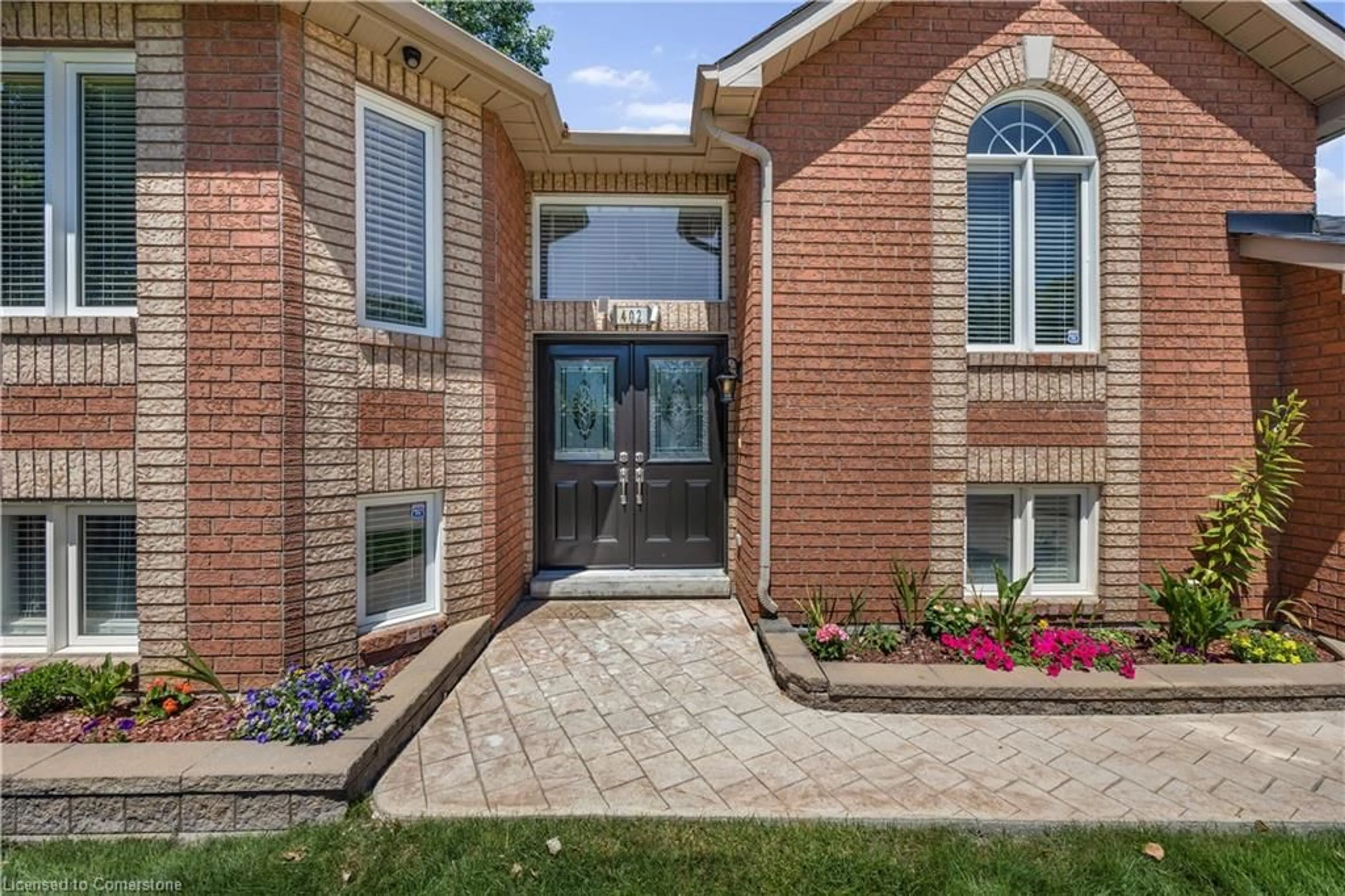 Home with brick exterior material, street for 402 Ramblewood Dr, Wasaga Beach Ontario L9Z 2N9