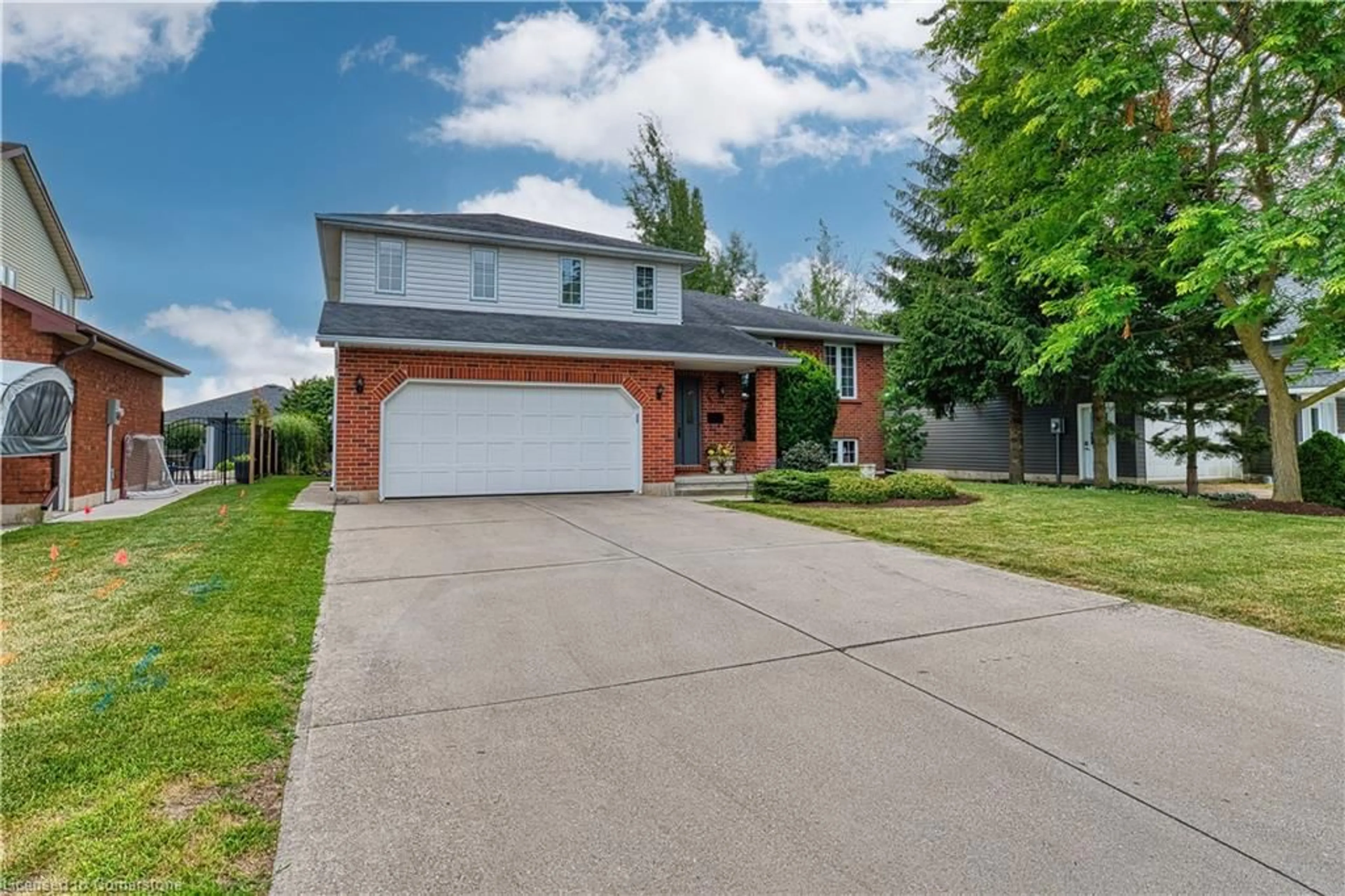Home with brick exterior material, street for 596 Elm Ave, Listowel Ontario N4W 3G2