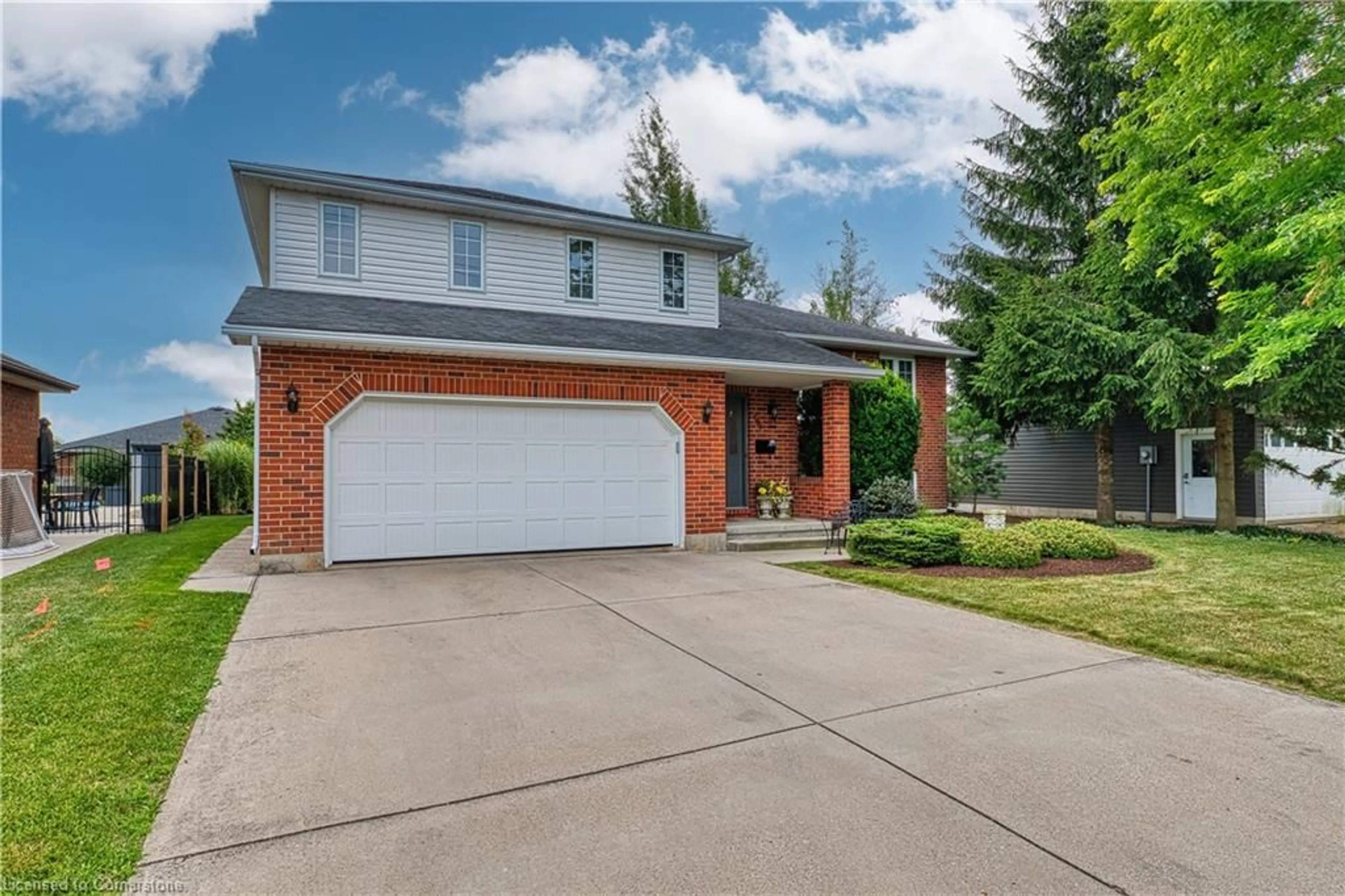 Home with brick exterior material, street for 596 Elm Ave, Listowel Ontario N4W 3G2