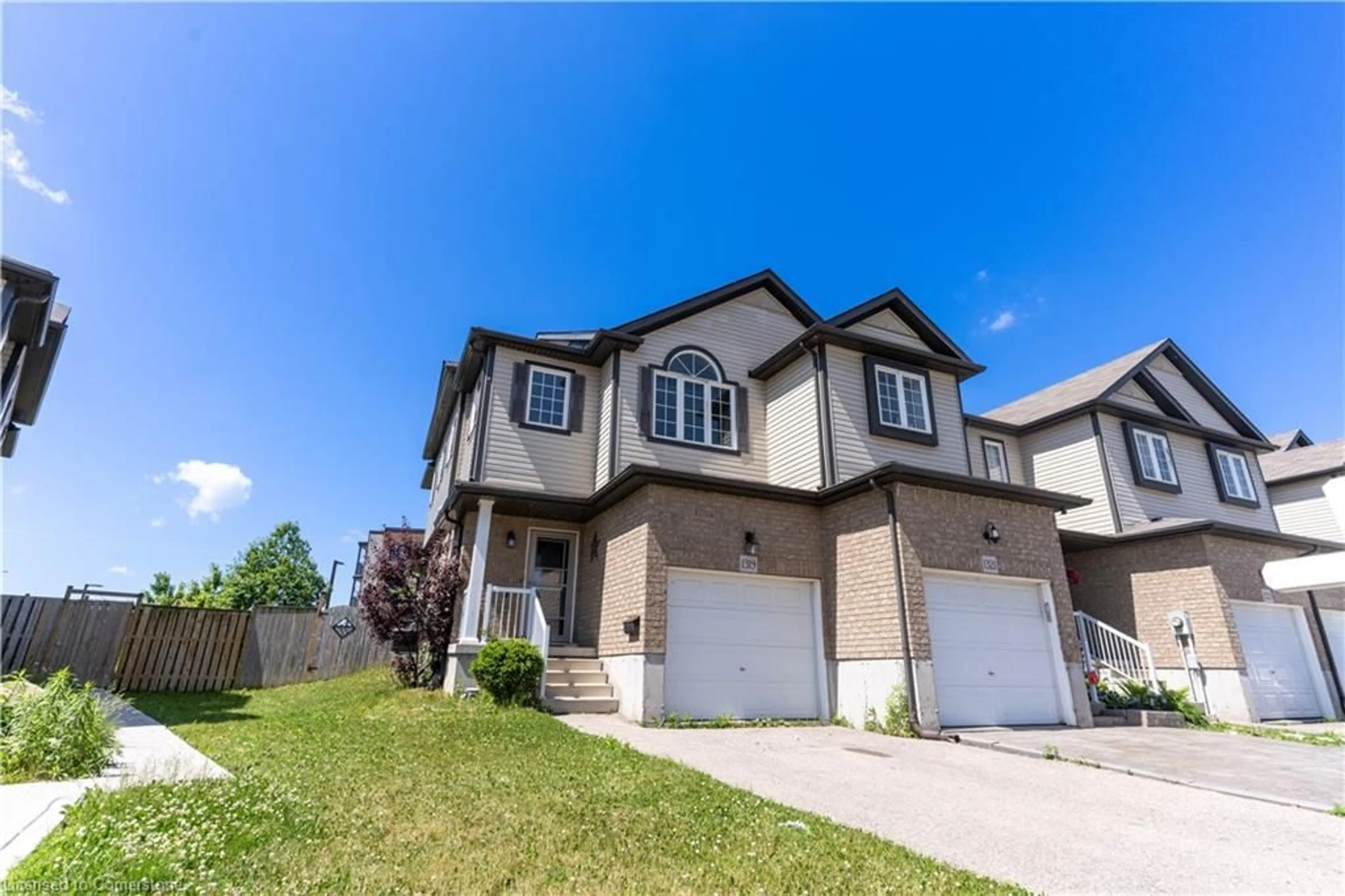 Home with vinyl exterior material, street for 1319 Countrystone Dr, Kitchener Ontario N2N 3R9