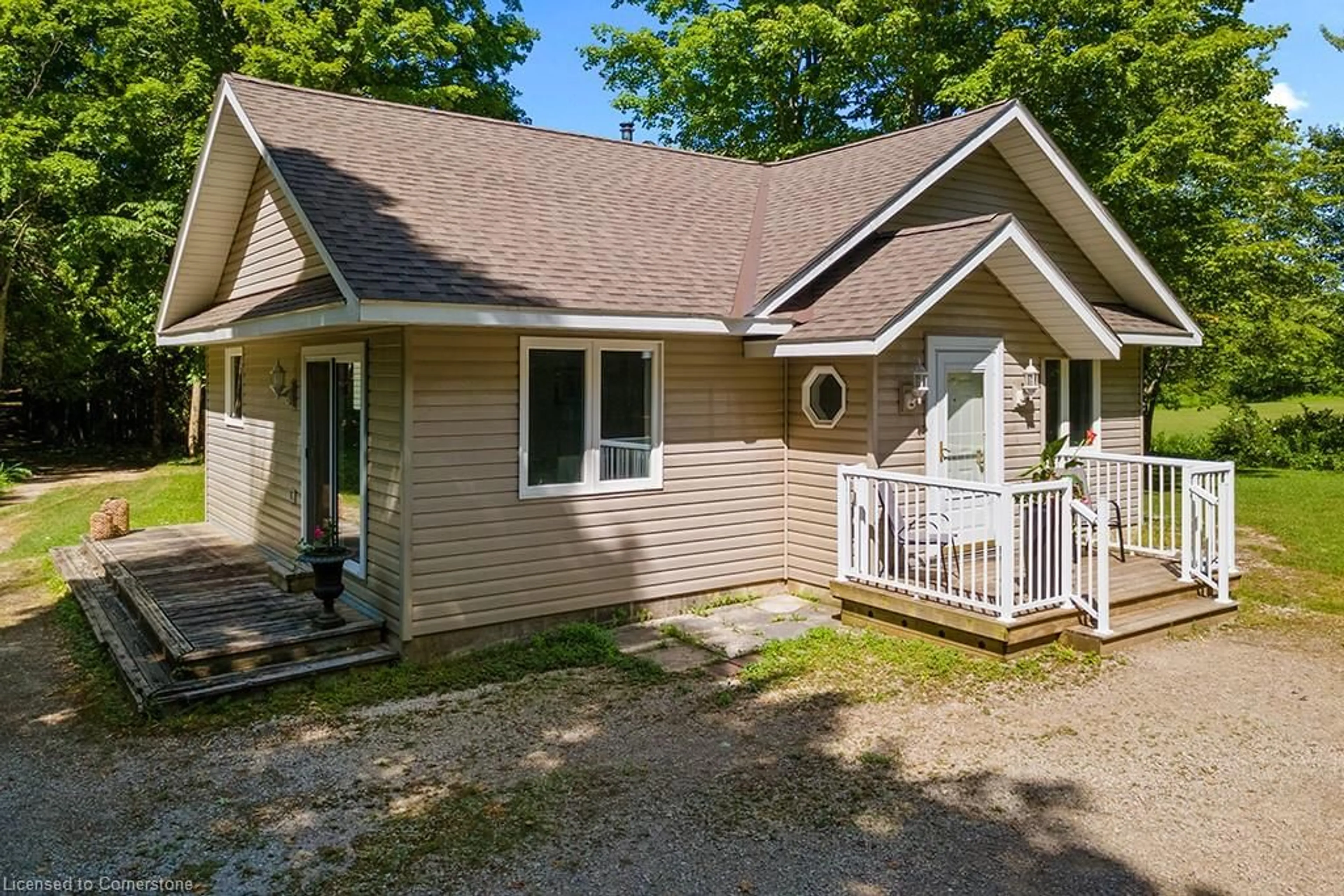Home with vinyl exterior material, street for 382185 17 Conc, Georgian Bluffs Ontario N0H 2T0