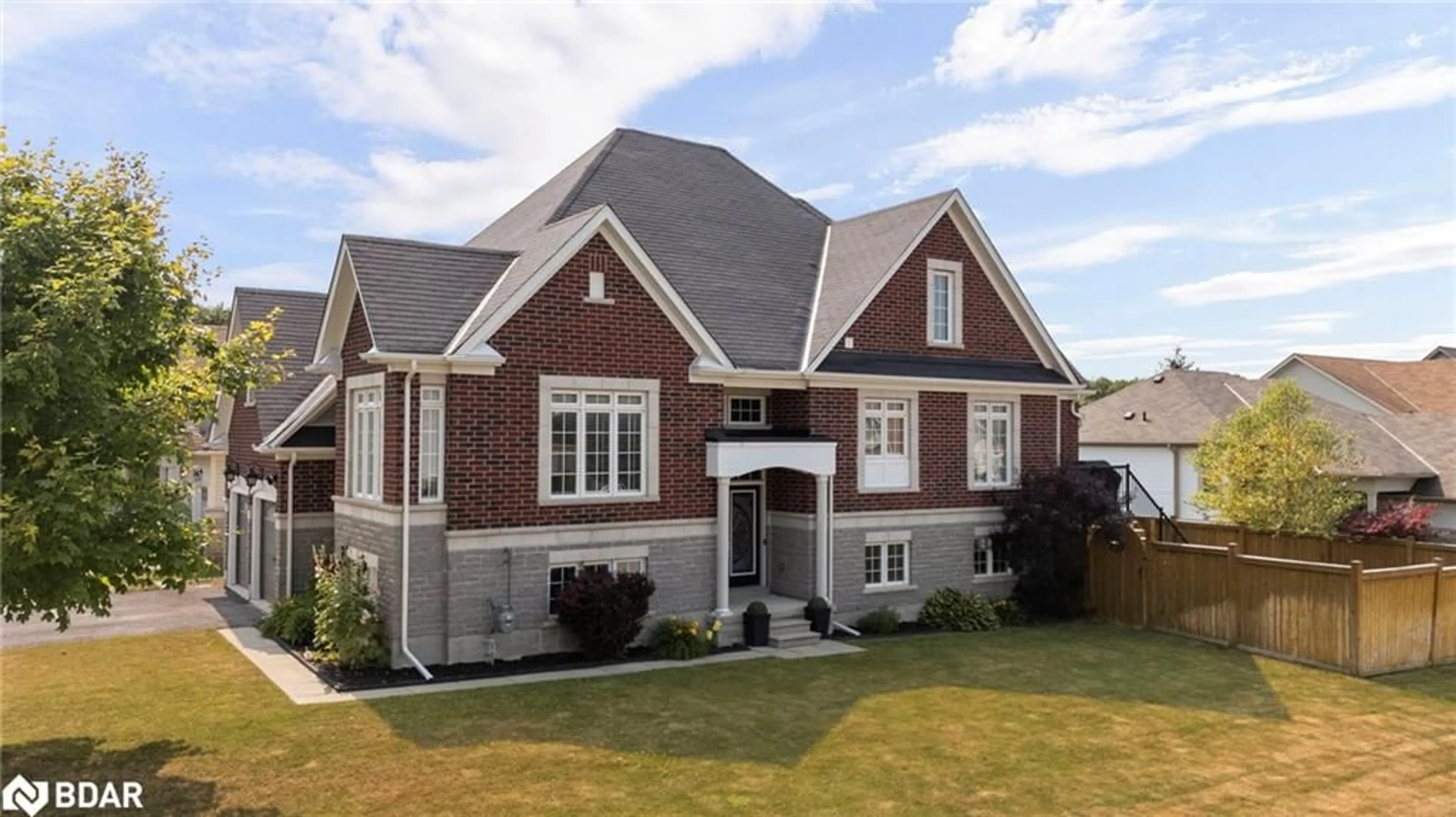 Home with brick exterior material, street for 105 White Sands Way, Wasaga Beach Ontario L9Z 0E2
