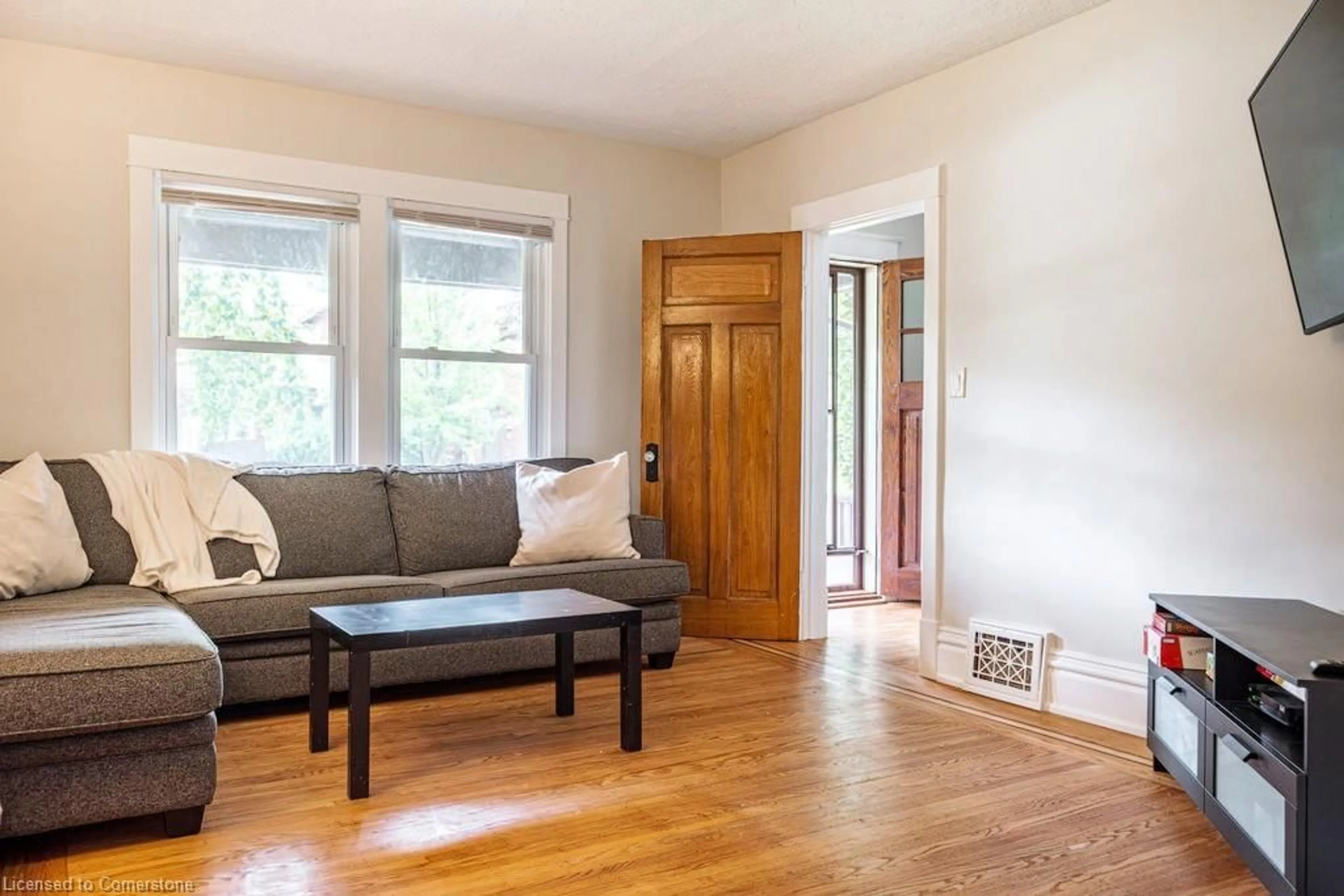 Living room with furniture, wood/laminate floor for 53 South Oval, Hamilton Ontario L8S 1P7