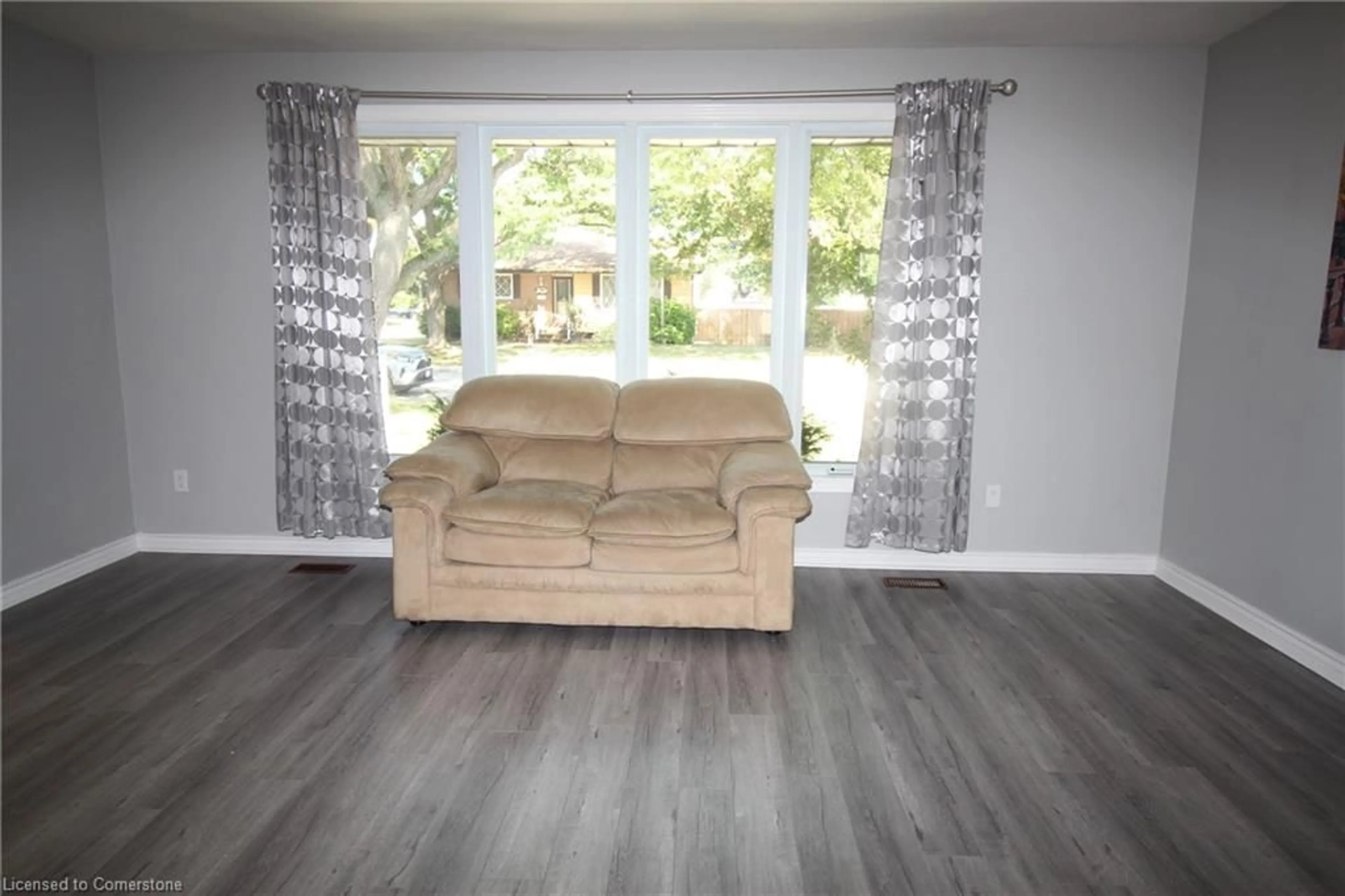Living room with furniture, wood/laminate floor for 4 Purnell Dr, Hamilton Ontario L9C 4X9