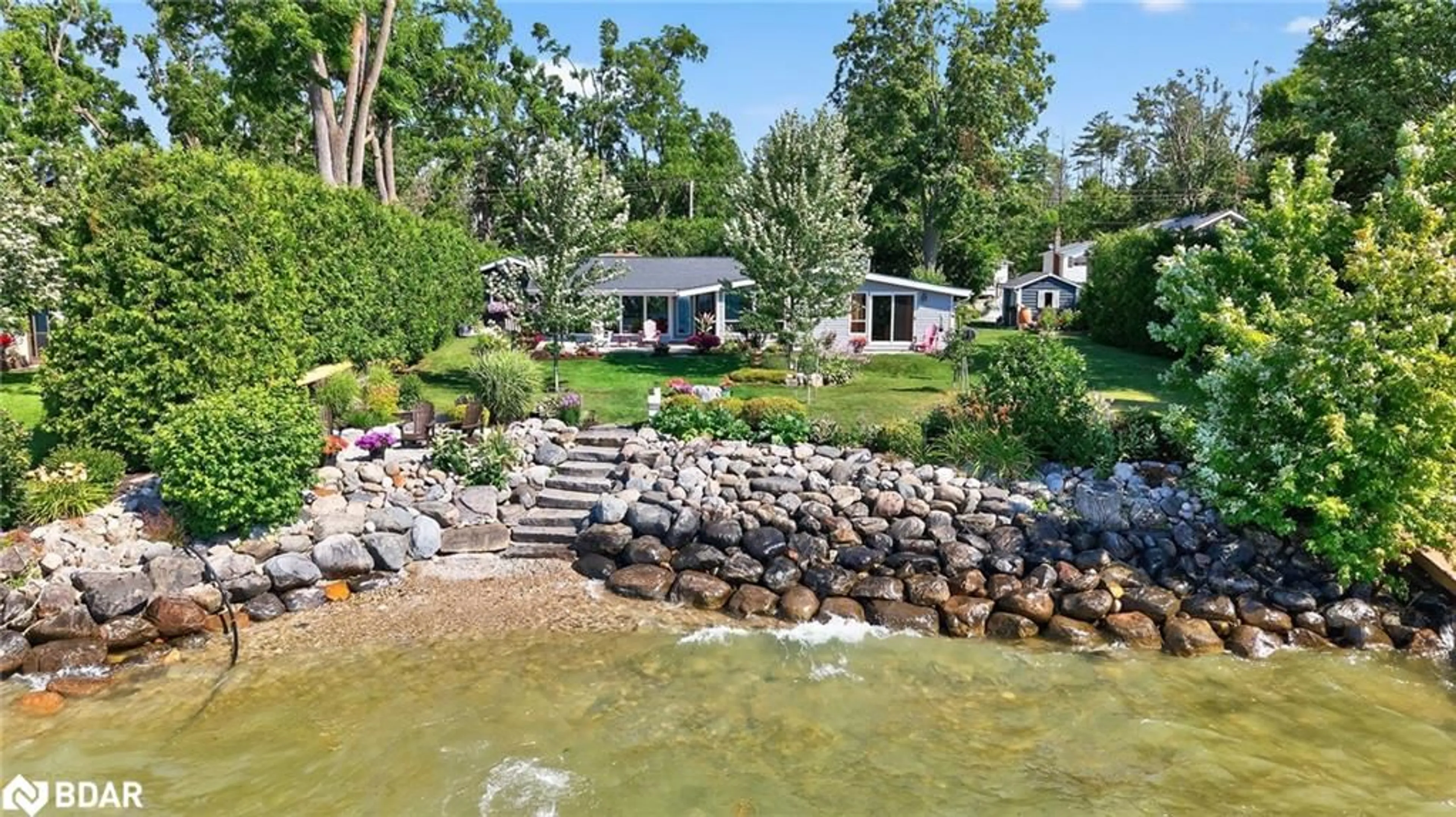 A pic from outside/outdoor area/front of a property/back of a property/a pic from drone, water/lake/river/ocean view for 7 Lakeshore Rd, Oro Station Ontario L0L 2E0