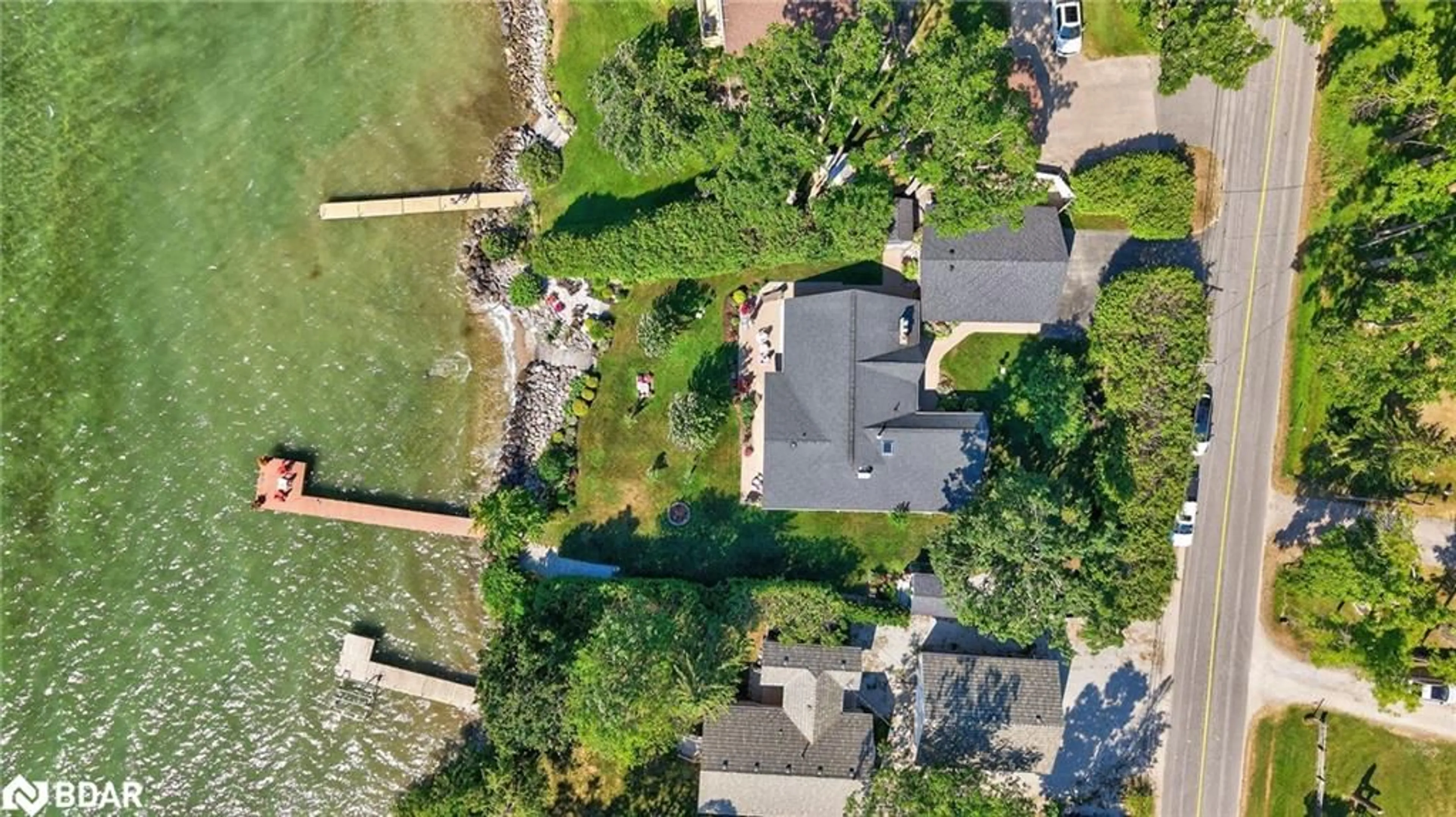 A pic from outside/outdoor area/front of a property/back of a property/a pic from drone, water/lake/river/ocean view for 7 Lakeshore Rd, Oro Station Ontario L0L 2E0