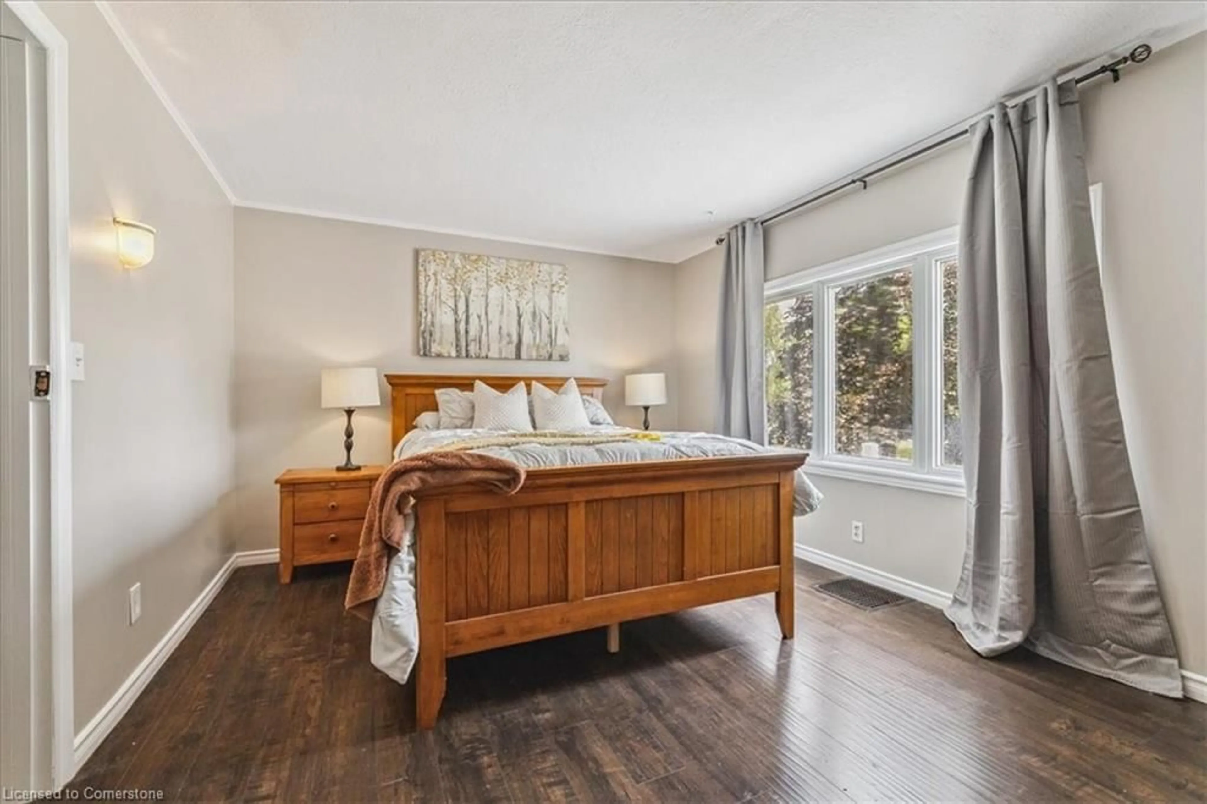 Bedroom with bed, wood/laminate floor for 1591 Merrittville Hwy, Welland Ontario L3B 5N5