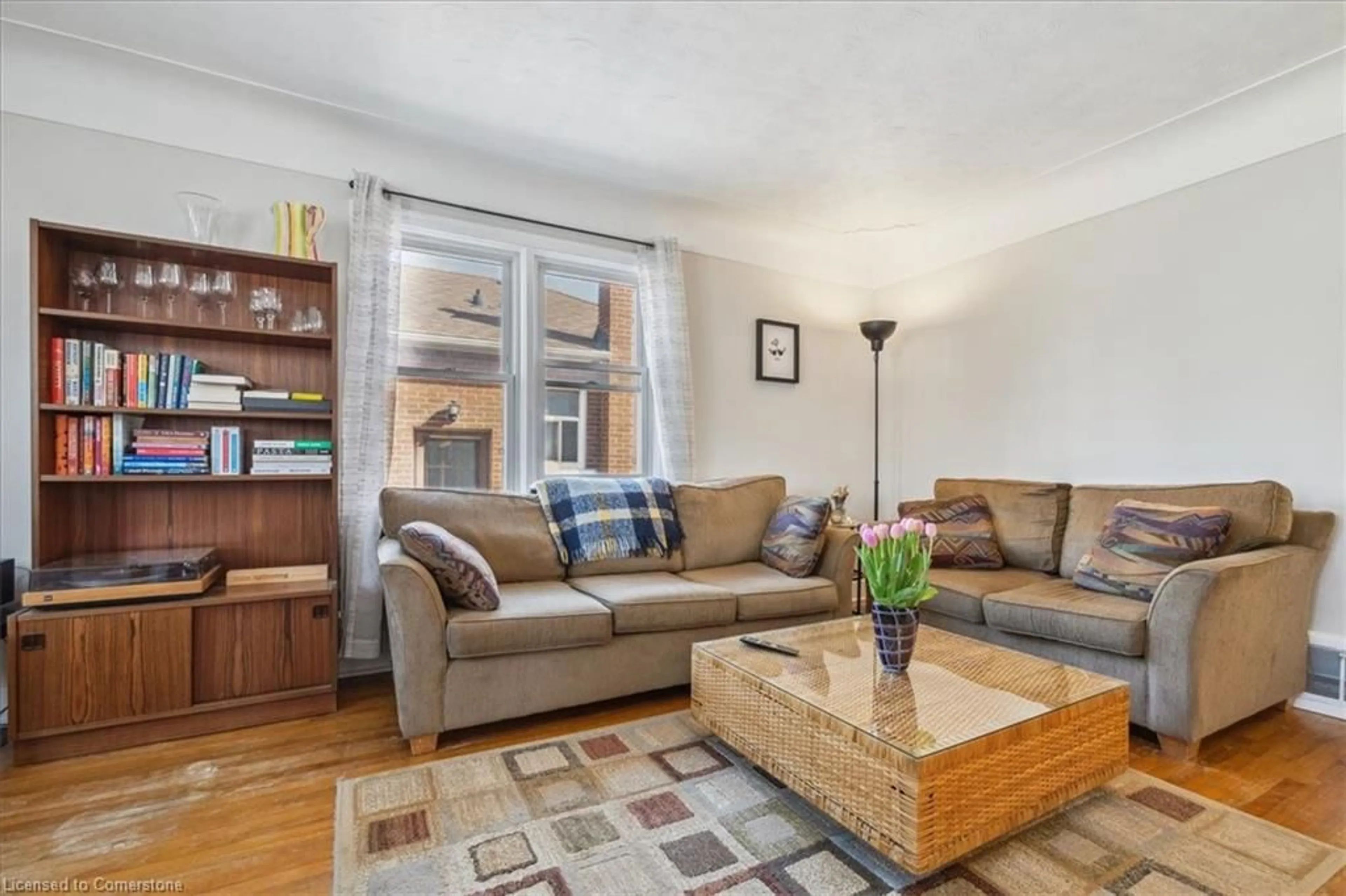Living room with furniture, wood/laminate floor for 273 Bowman St, Hamilton Ontario L8S 2T9