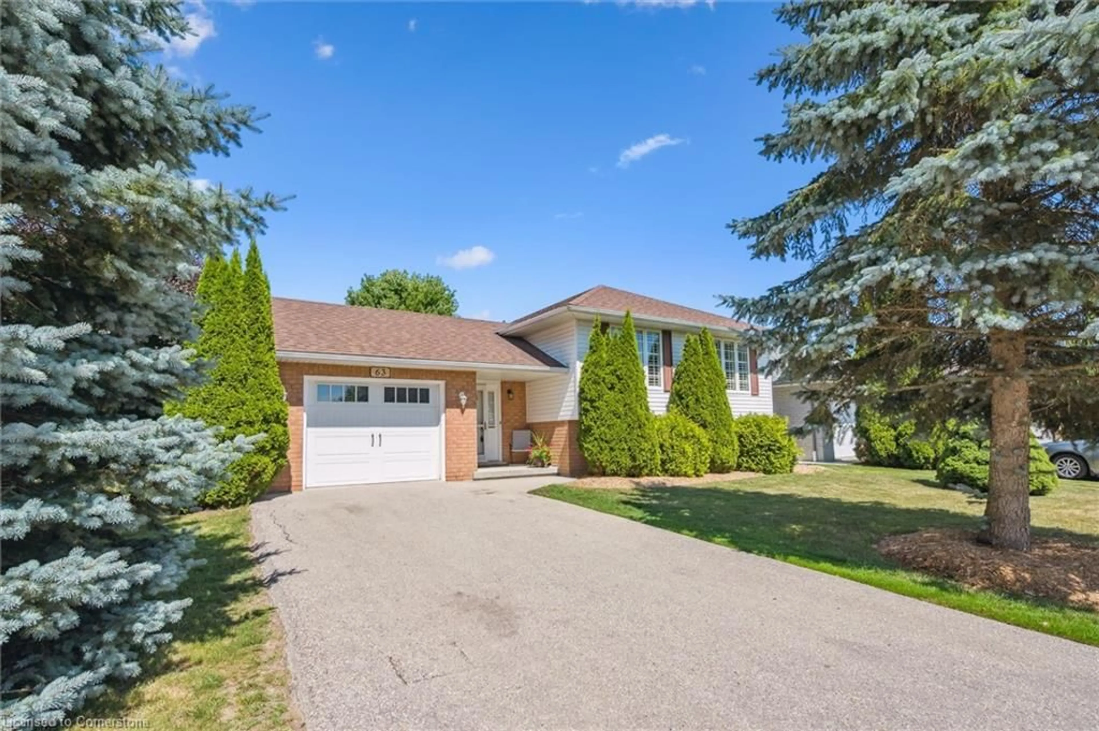 Home with brick exterior material, street for 63 Thomas Blvd, Elora Ontario N0B 1S0
