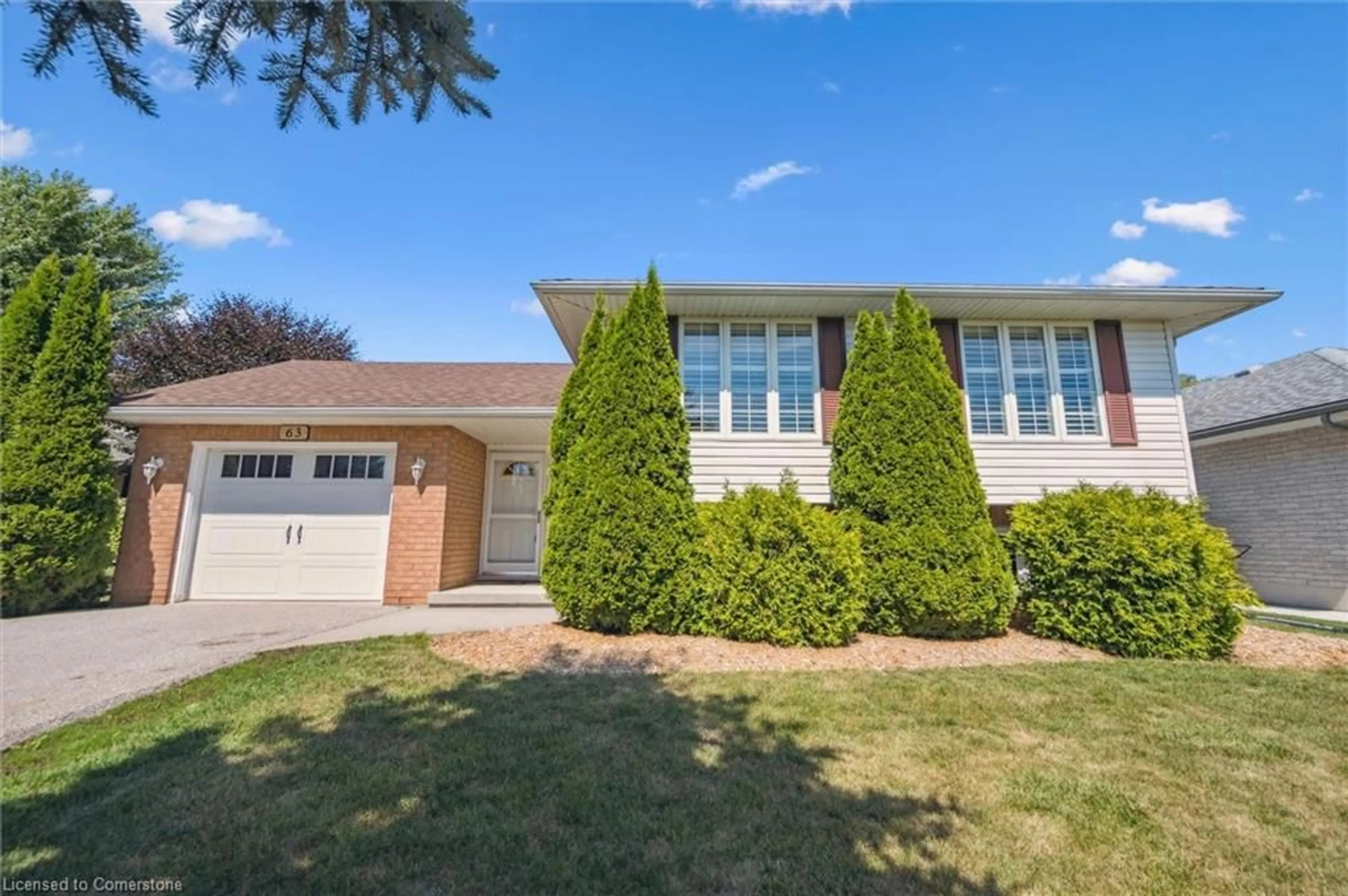 Home with brick exterior material, street for 63 Thomas Blvd, Elora Ontario N0B 1S0