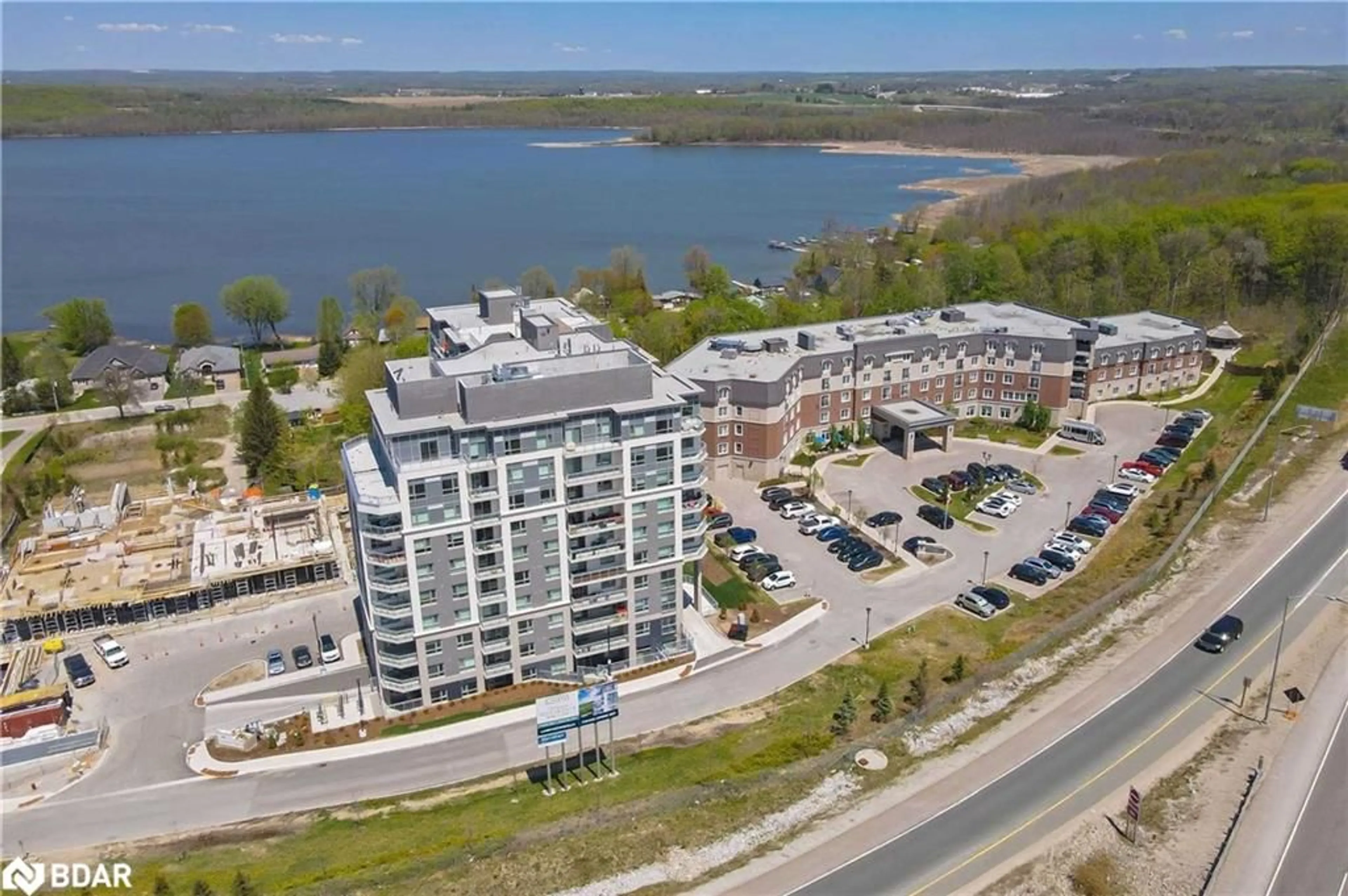 A pic from outside/outdoor area/front of a property/back of a property/a pic from drone, water/lake/river/ocean view for 58 Lakeside Terr #712, Barrie Ontario L4M 0H9