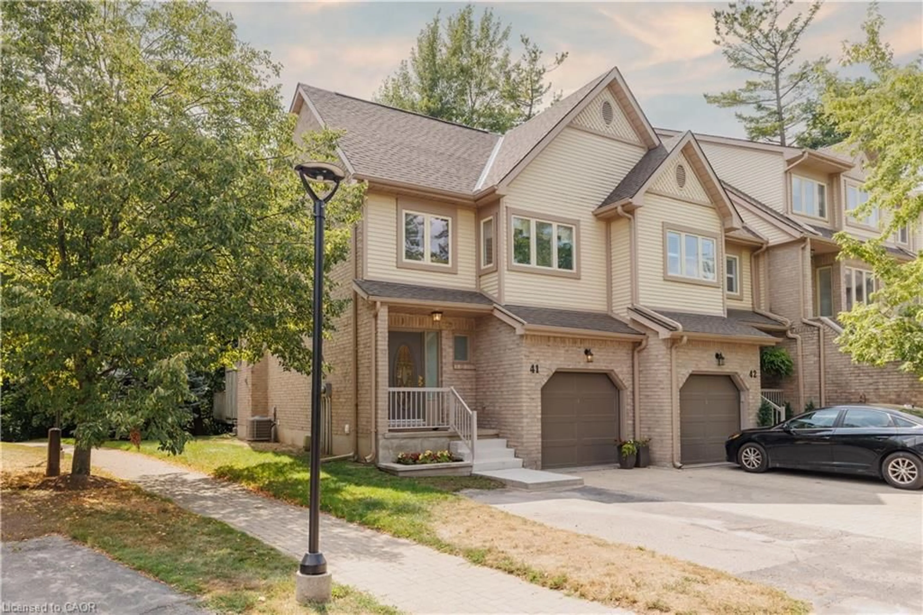Home with brick exterior material, street for 225 Benjamin Rd #41, Waterloo Ontario N2V 1Z3