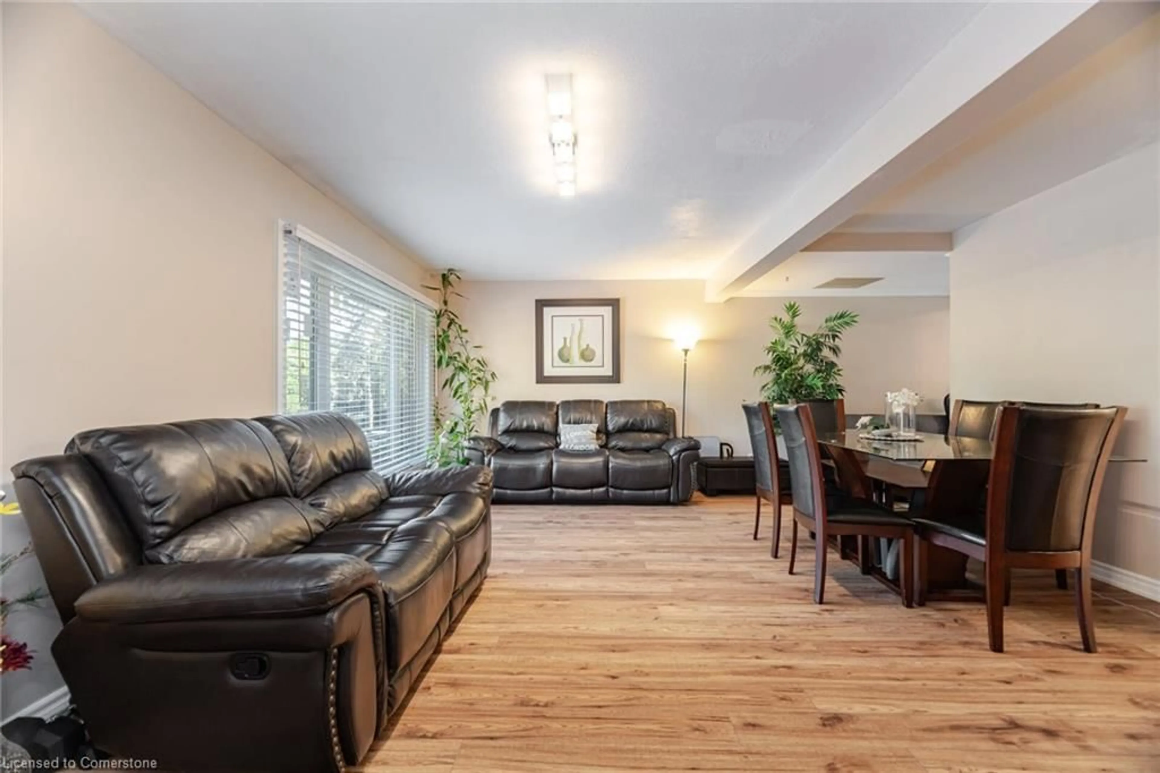 Living room with furniture, wood/laminate floor for 1021 Falgarwood Dr, Oakville Ontario L6H 1N7