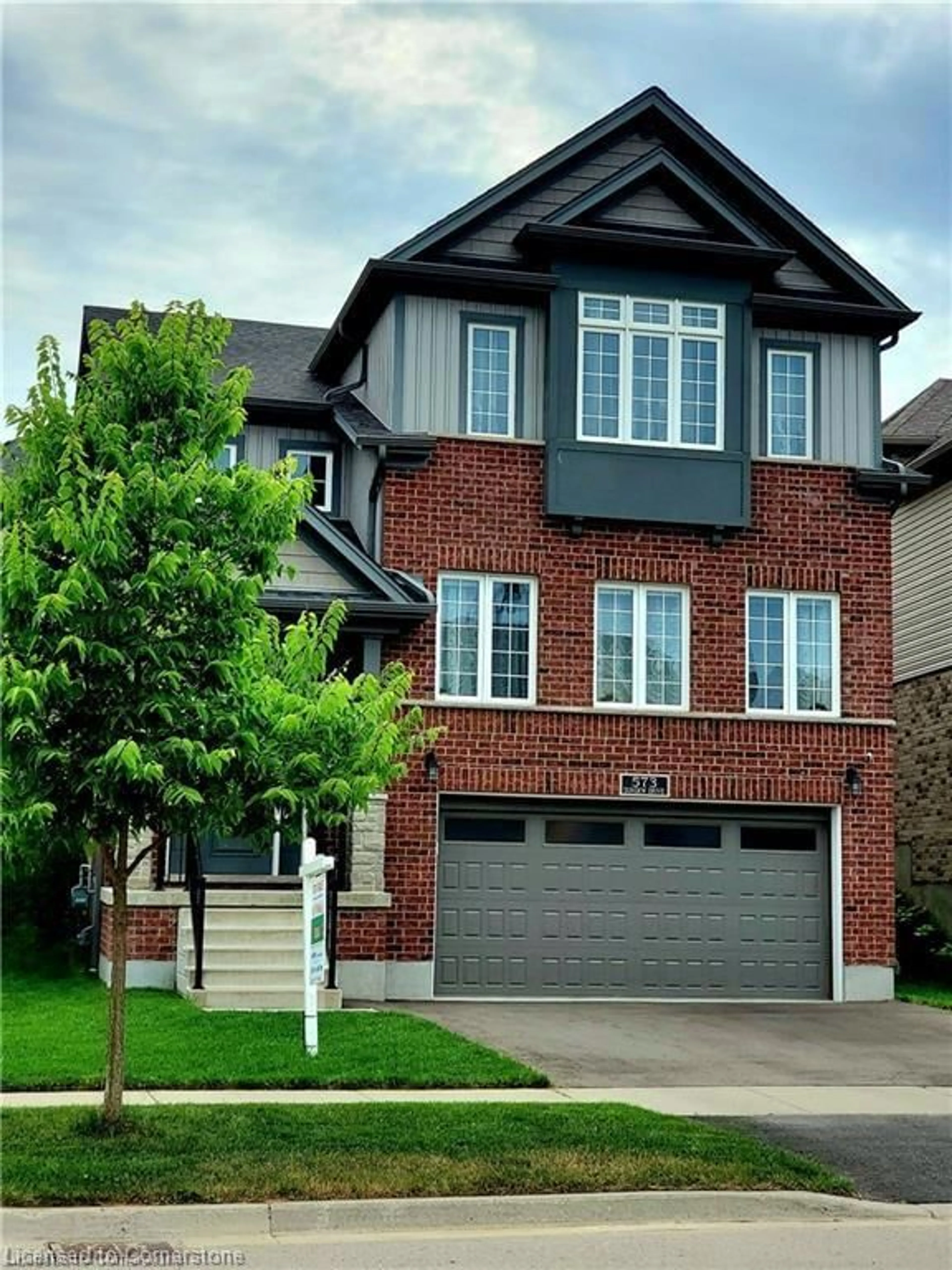 Home with brick exterior material, street for 573 Sundew Dr, Waterloo Ontario N2V 0B9