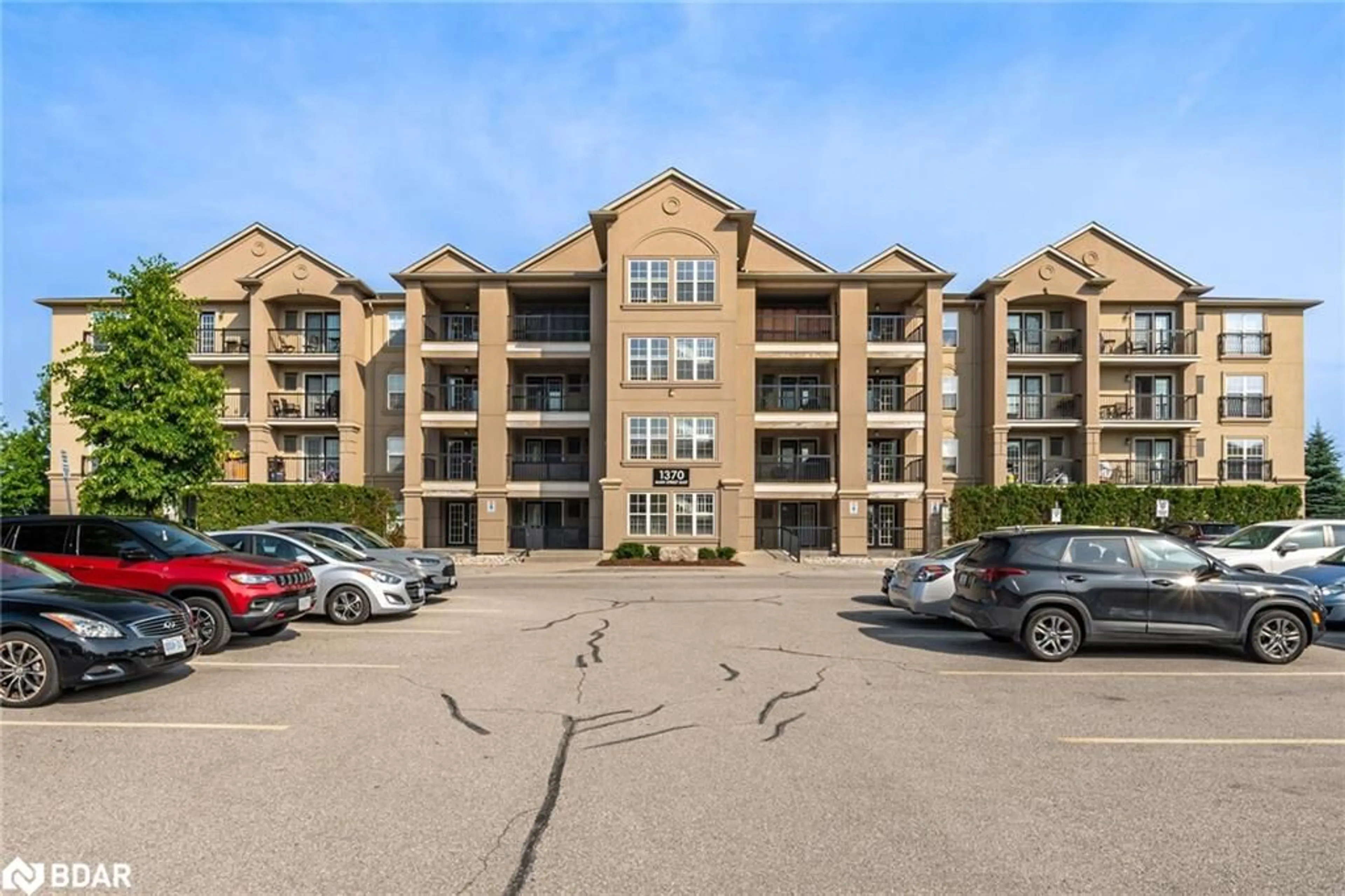 A pic from outside/outdoor area/front of a property/back of a property/a pic from drone, unknown for 1370 Main St #105, Milton Ontario L9T 7S8