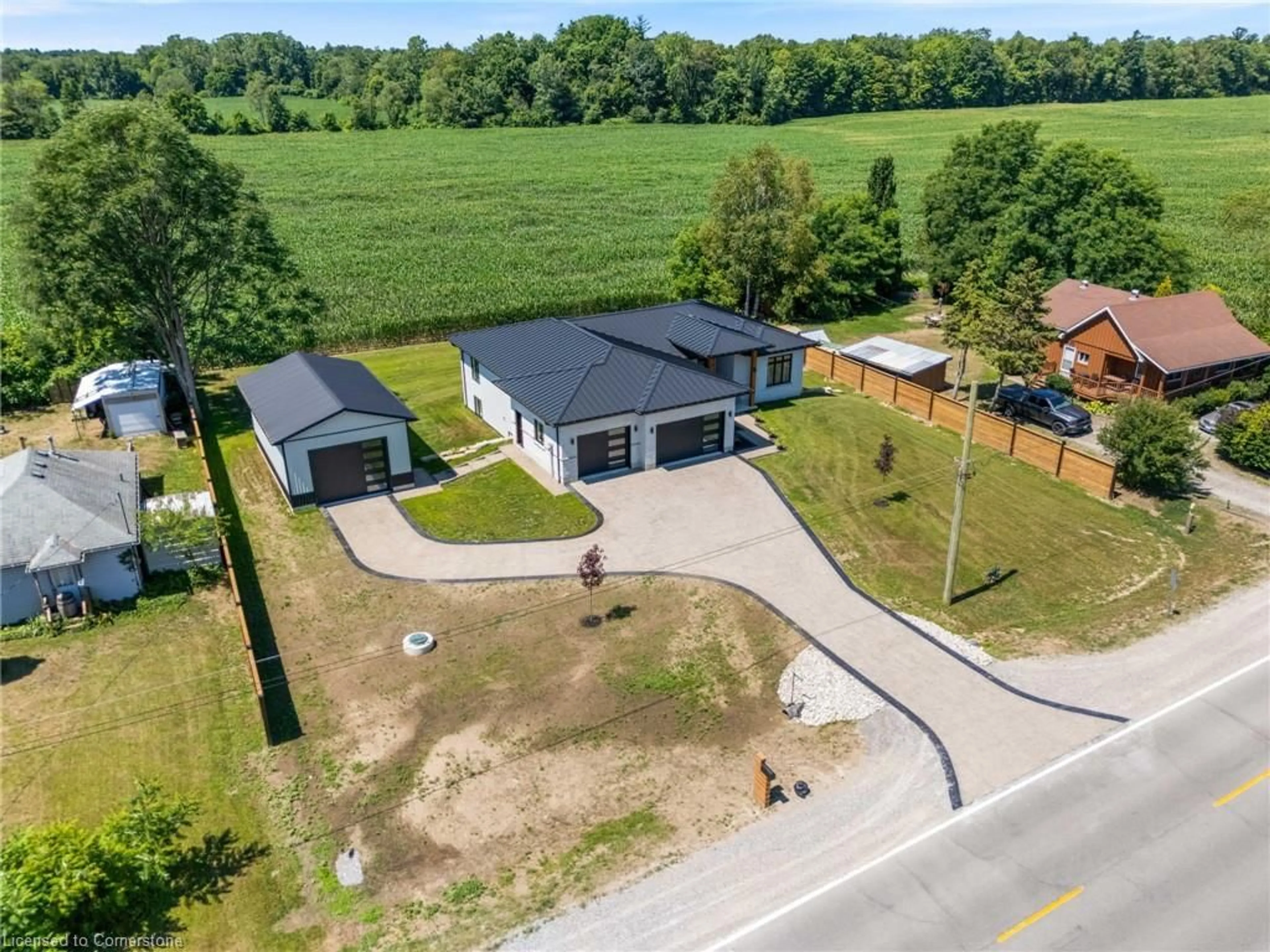 A pic from outside/outdoor area/front of a property/back of a property/a pic from drone, street for 3199 Highway 59, Langton Ontario N0E 1G0