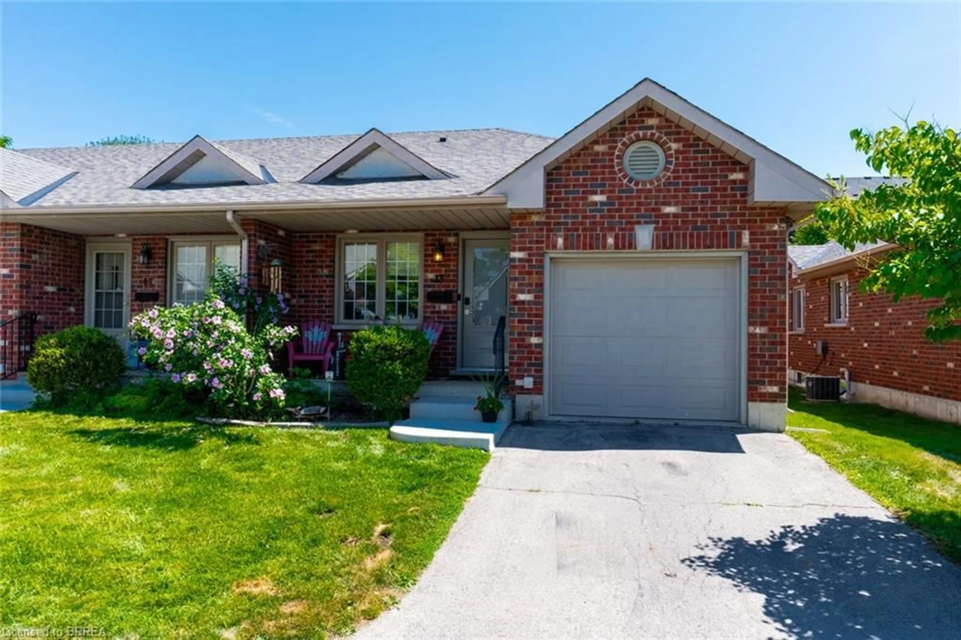 Home with brick exterior material, street for 694 Grey St #13, Brantford Ontario N3S 4Y4