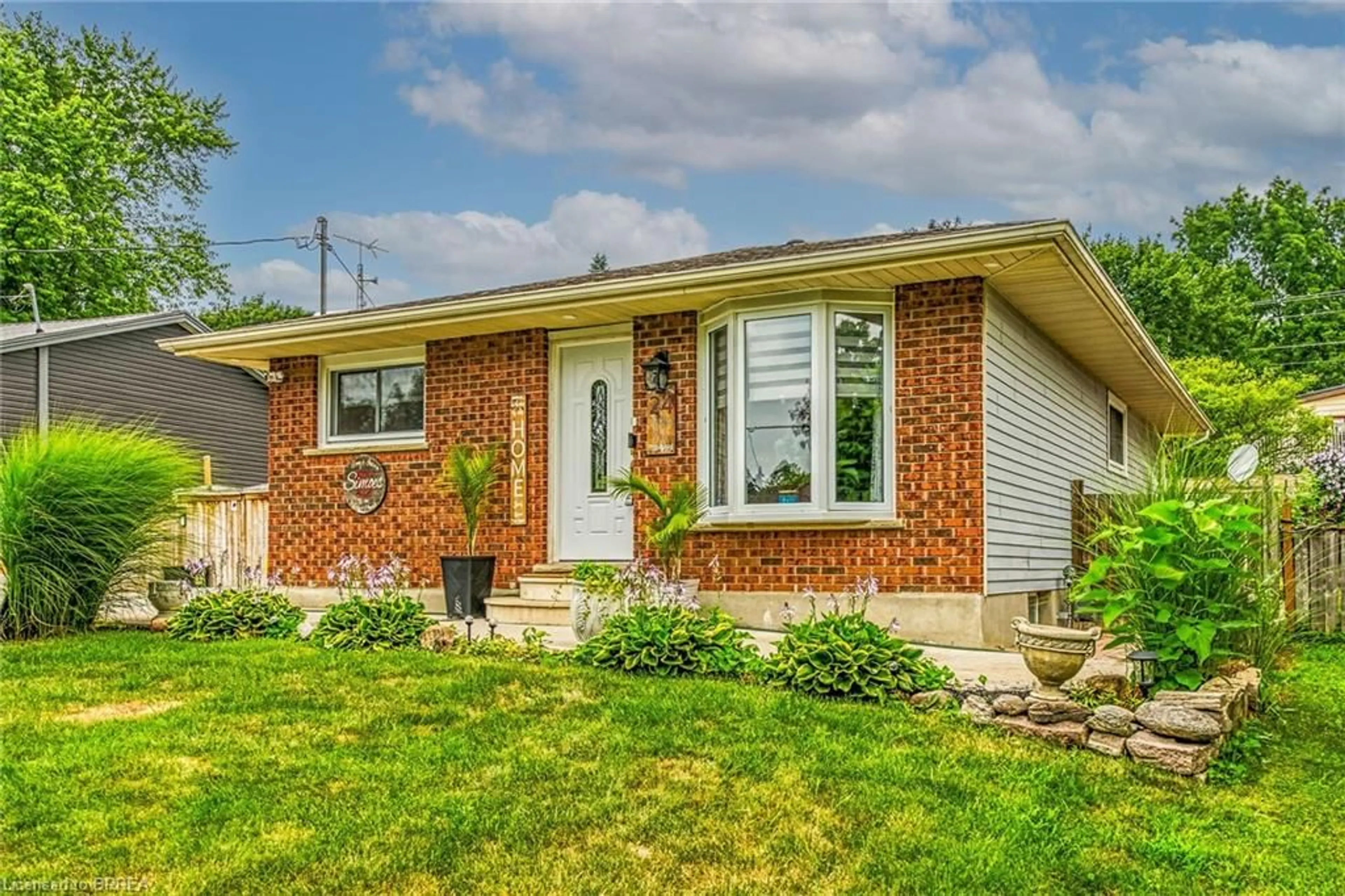 Home with brick exterior material, street for 24 Ashton Dr, Simcoe Ontario N3Y 2S4