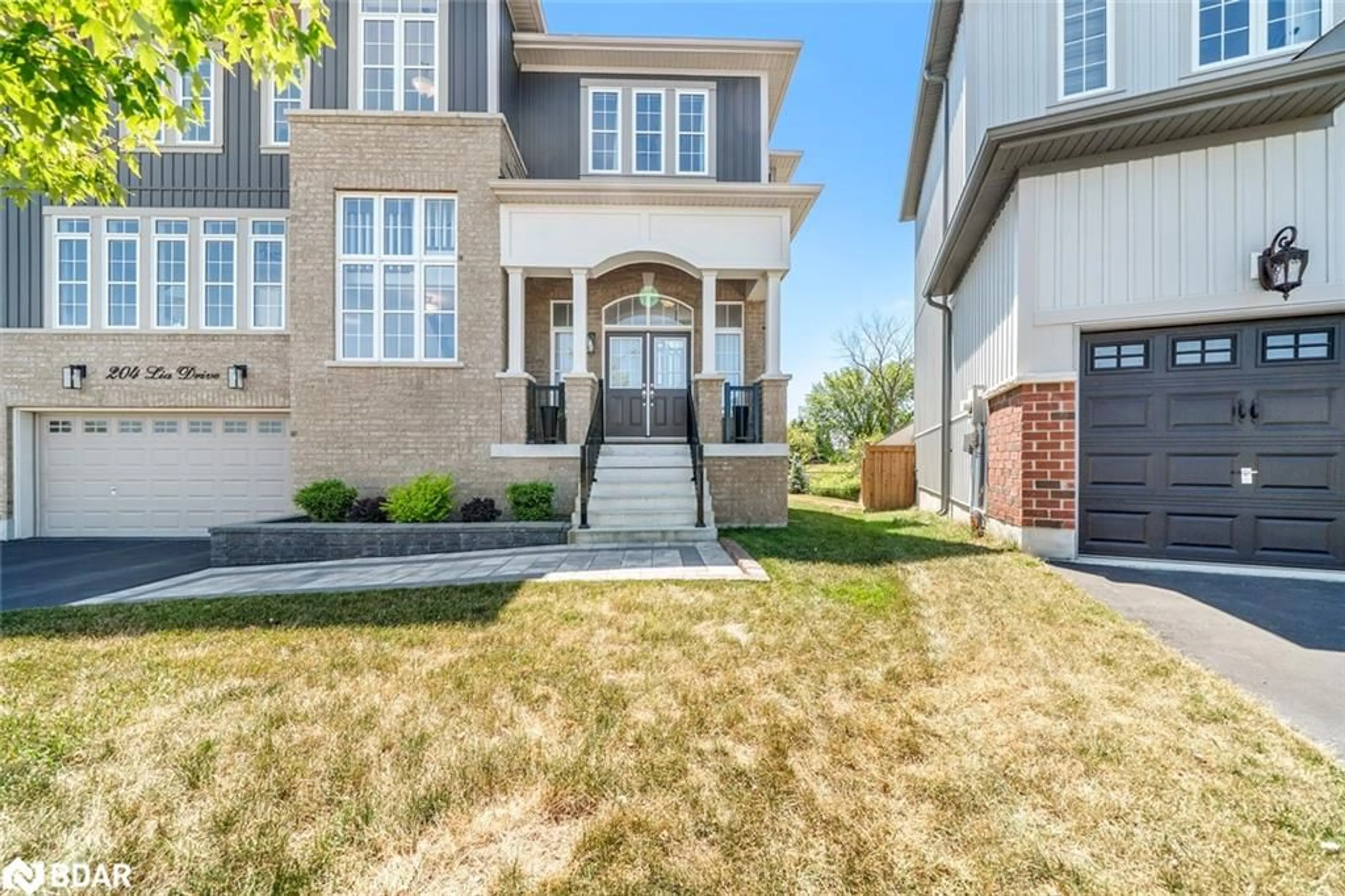 Home with brick exterior material, street for 204 Lia Drive, Stayner Ontario L0M 1S0