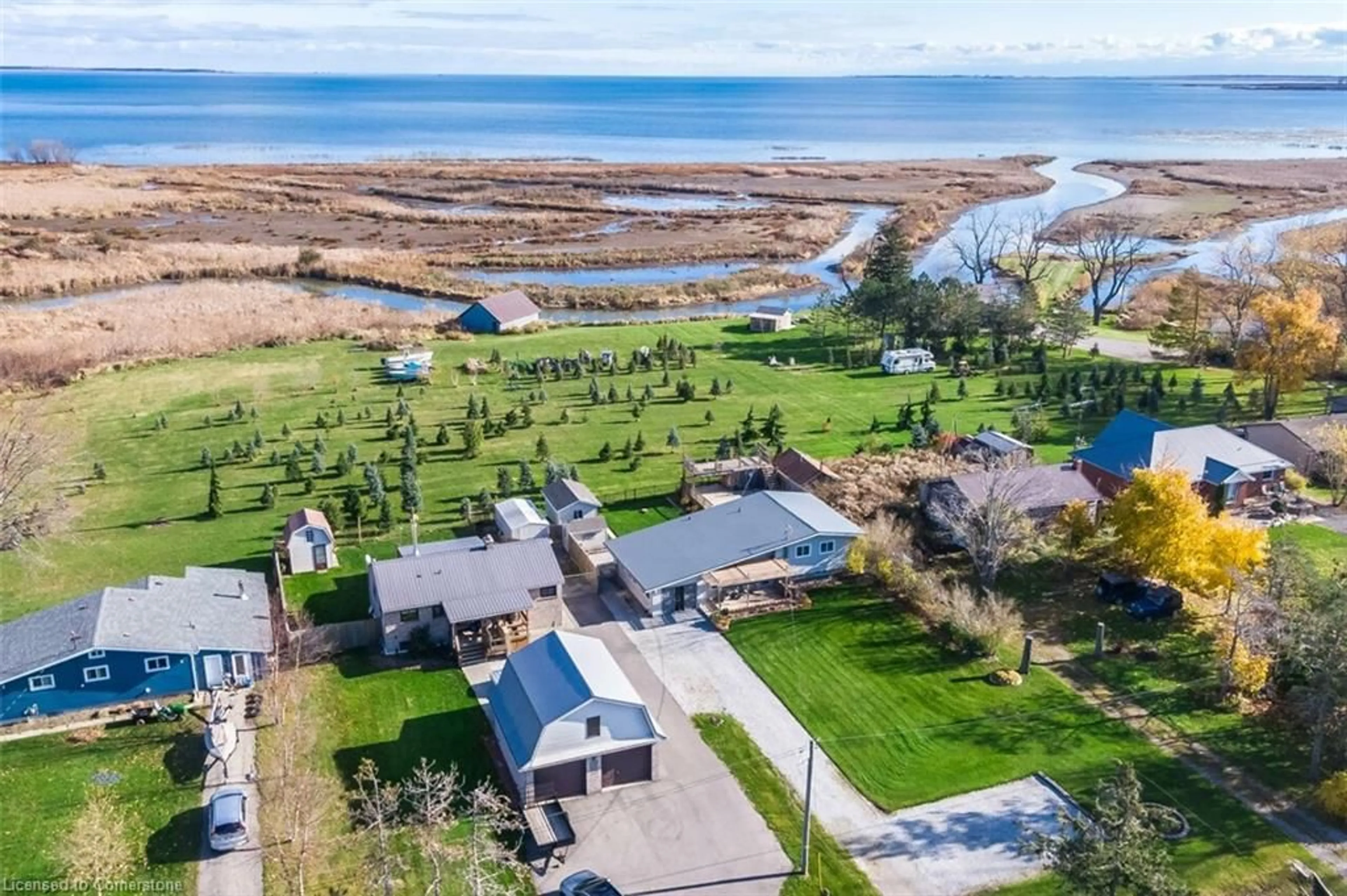 A pic from outside/outdoor area/front of a property/back of a property/a pic from drone, water/lake/river/ocean view for 982 59 Hwy, Port Rowan Ontario N0E 1M0
