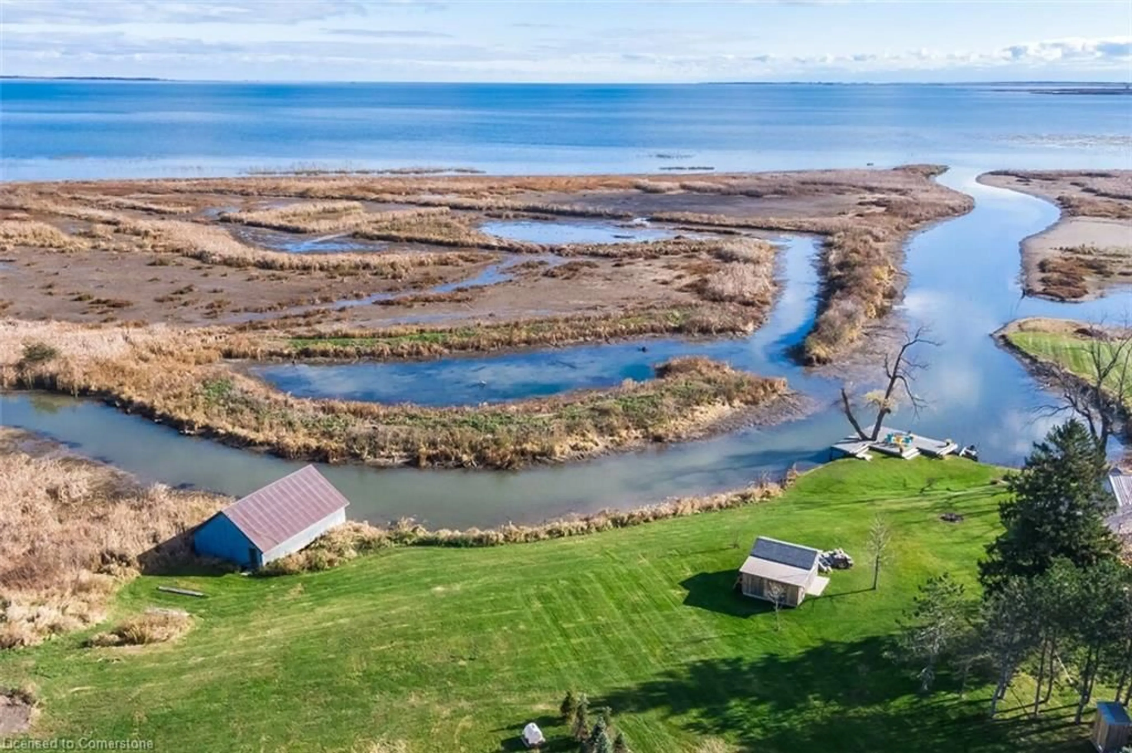 A pic from outside/outdoor area/front of a property/back of a property/a pic from drone, water/lake/river/ocean view for 982 59 Hwy, Port Rowan Ontario N0E 1M0