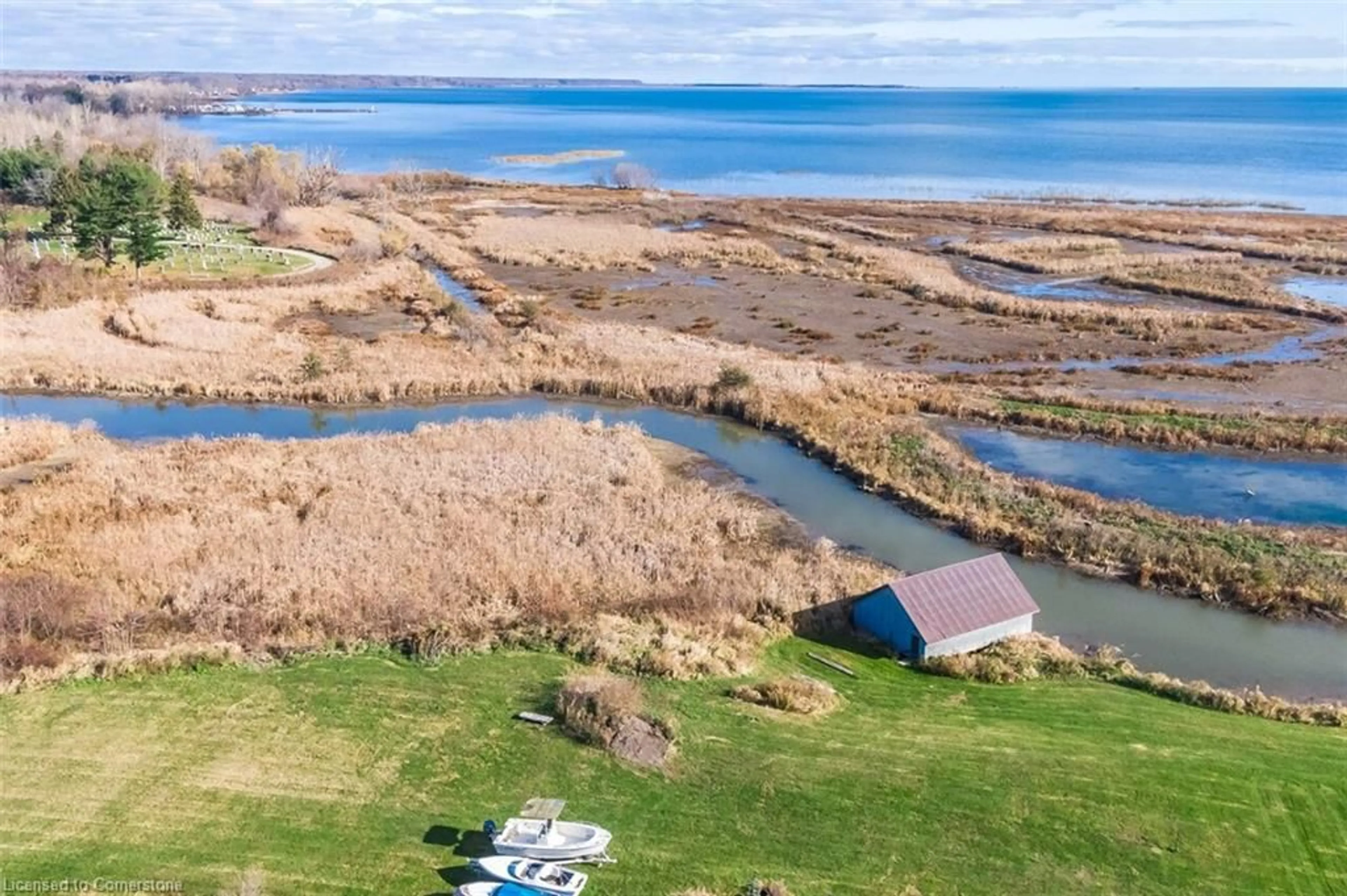 A pic from outside/outdoor area/front of a property/back of a property/a pic from drone, water/lake/river/ocean view for 982 59 Hwy, Port Rowan Ontario N0E 1M0