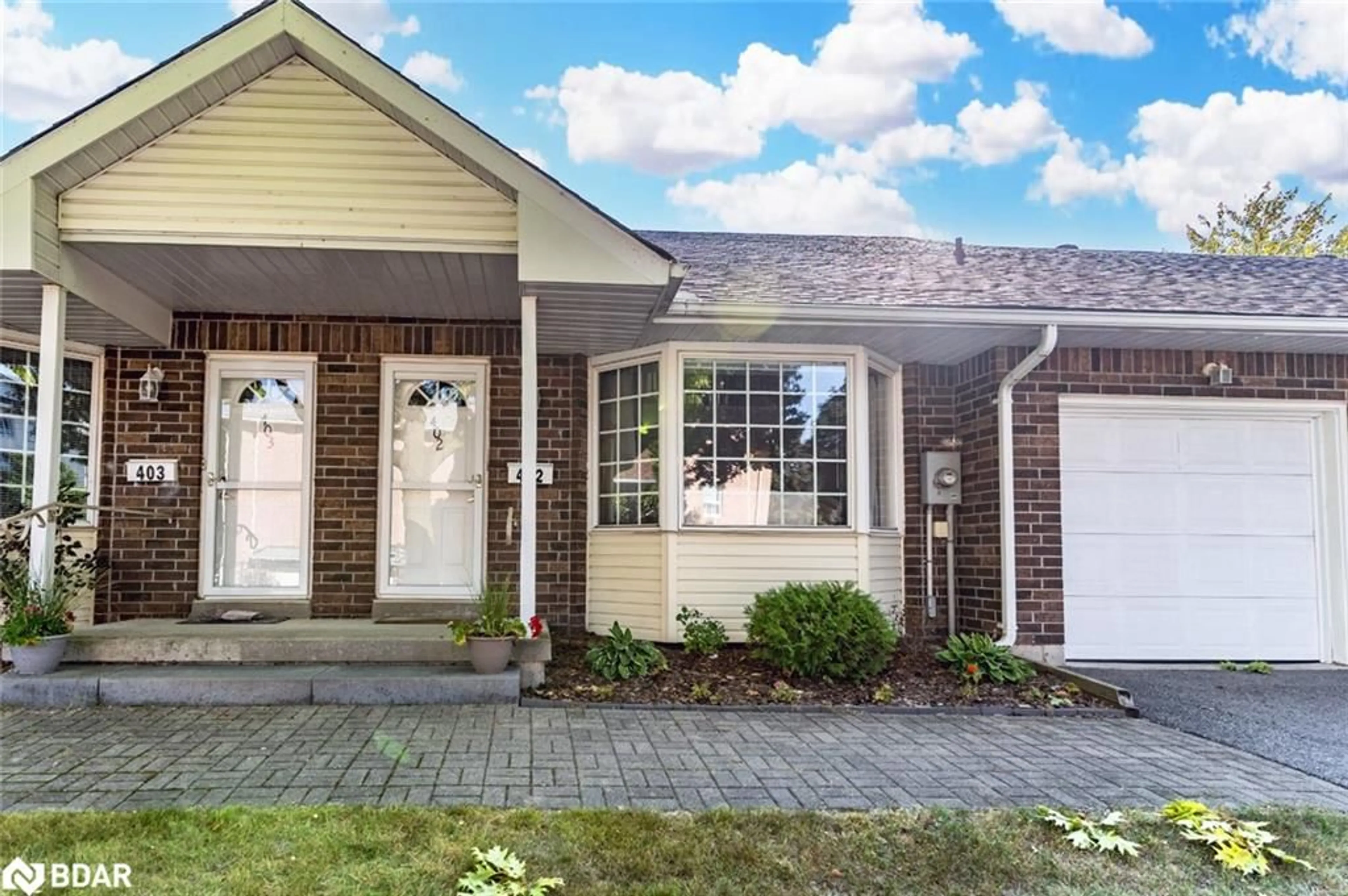 Home with vinyl exterior material, street for 40 Museum Dr #402, Orillia Ontario L3V 7T9