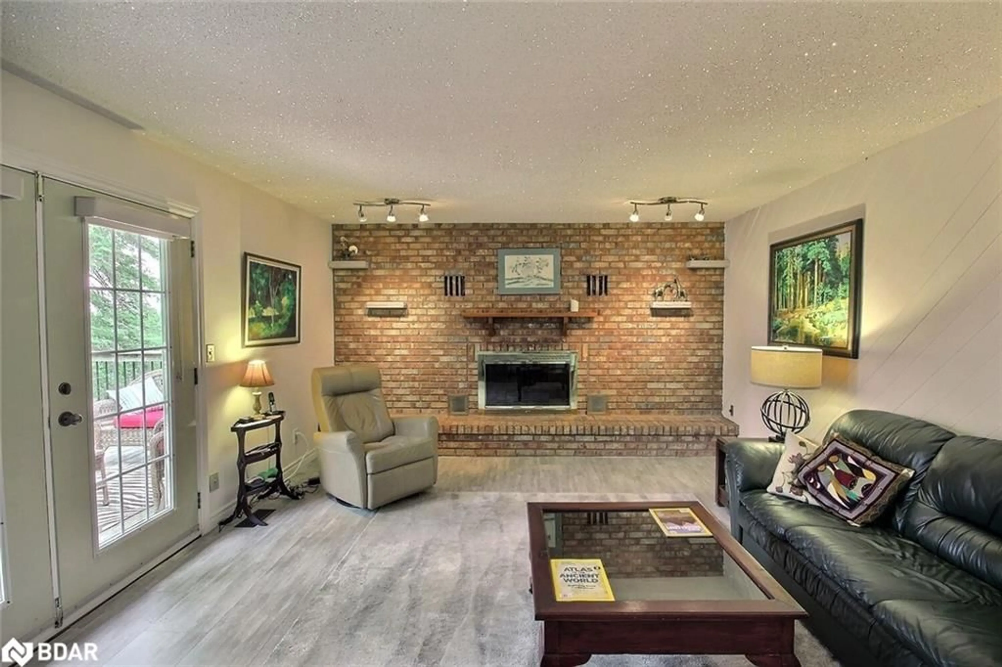 Living room with furniture, ceramic/tile floor for 3268 County Road 3 Rd, Carrying Place Ontario K0K 1L0