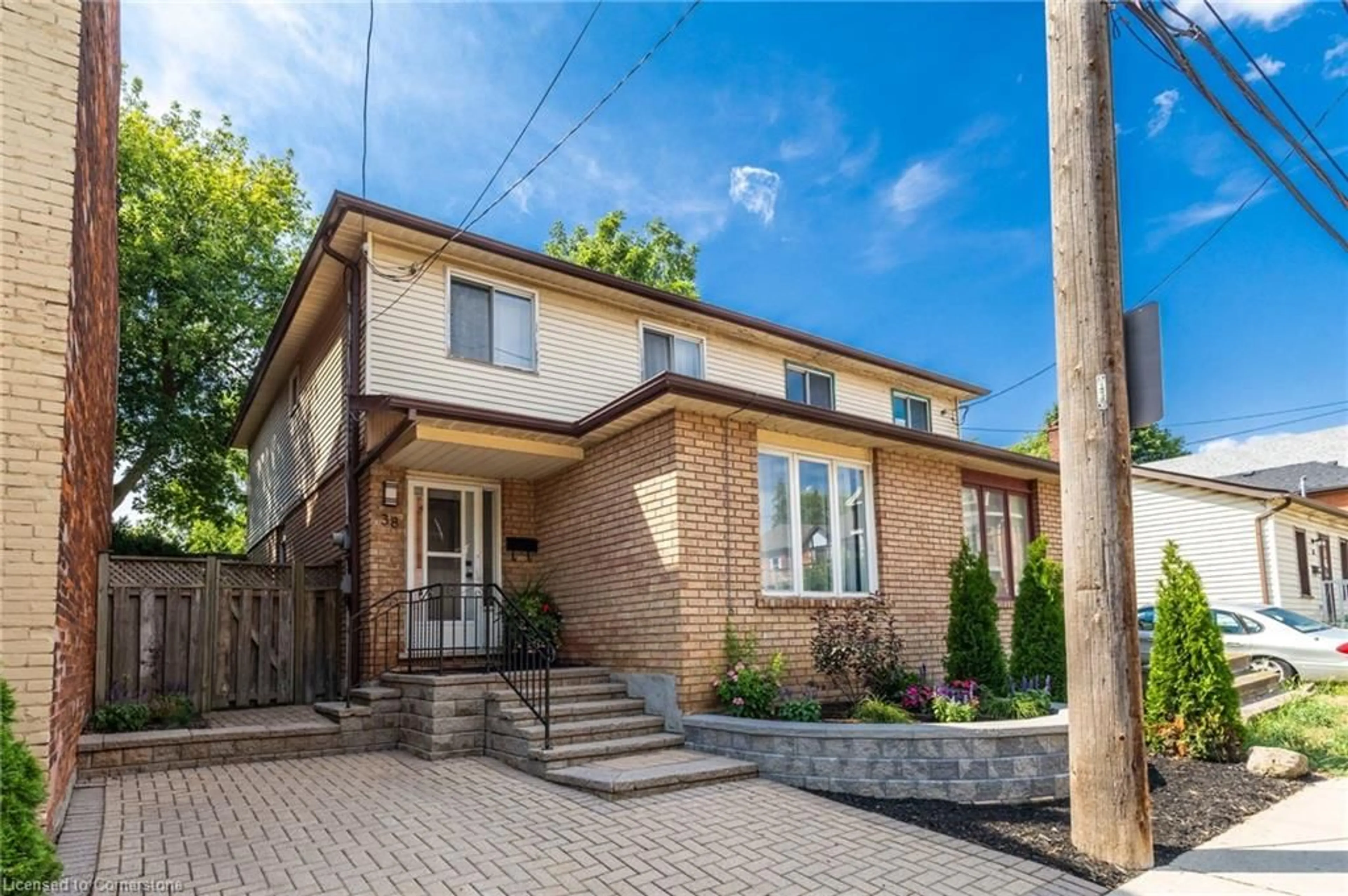 Home with brick exterior material, street for 38 Locke St, Hamilton Ontario L8P 3Z8