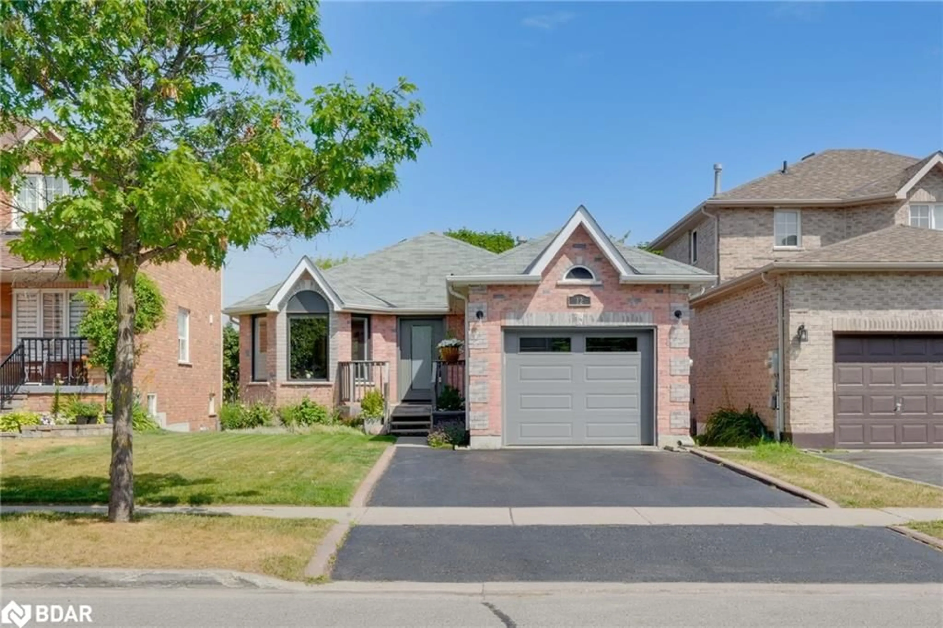 Home with brick exterior material, street for 12 Dunnett Dr, Barrie Ontario L4N 0H9