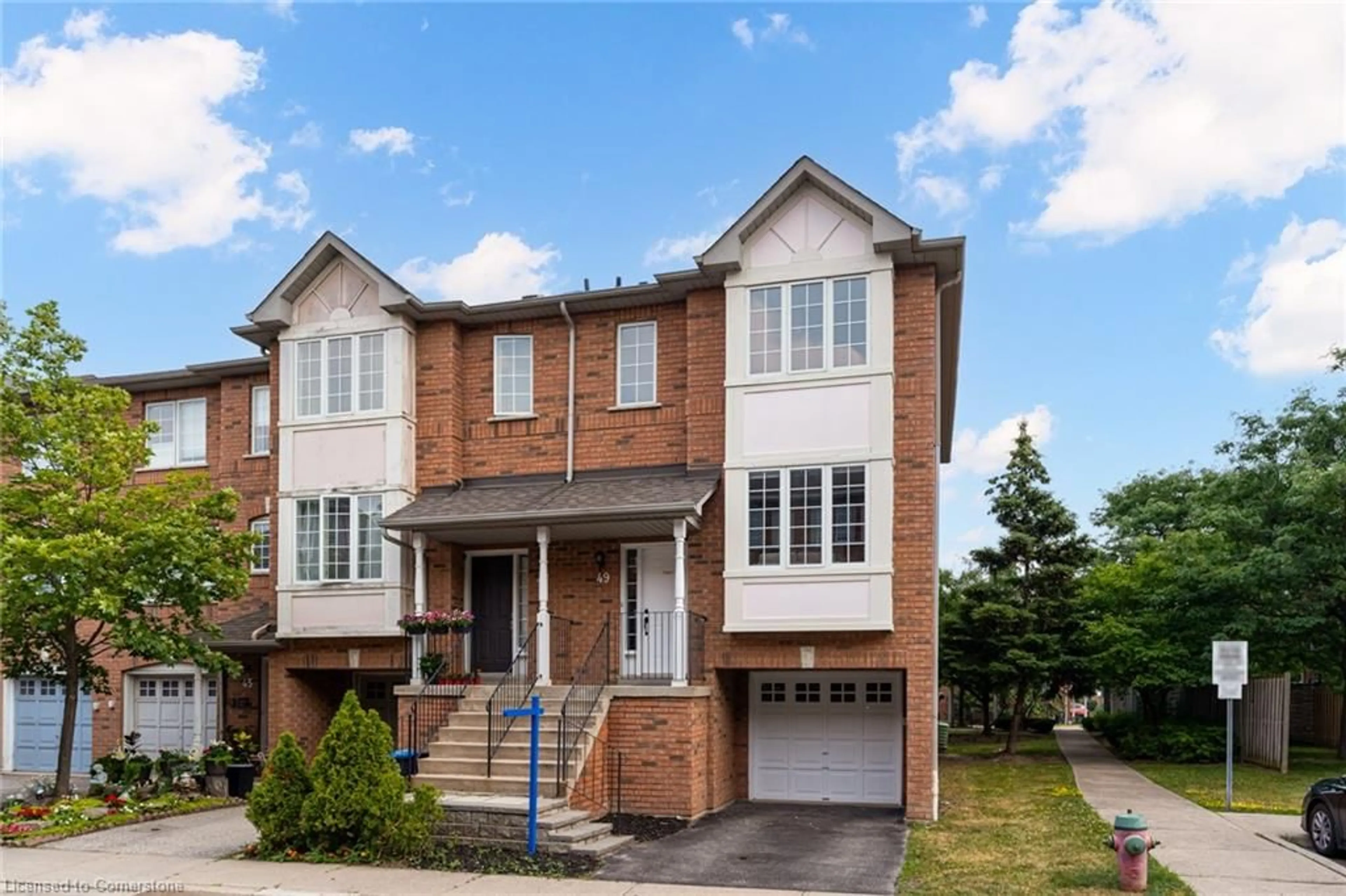 Home with brick exterior material, street for 80 Acorn Pl #49, Mississauga Ontario L4Z 4E1