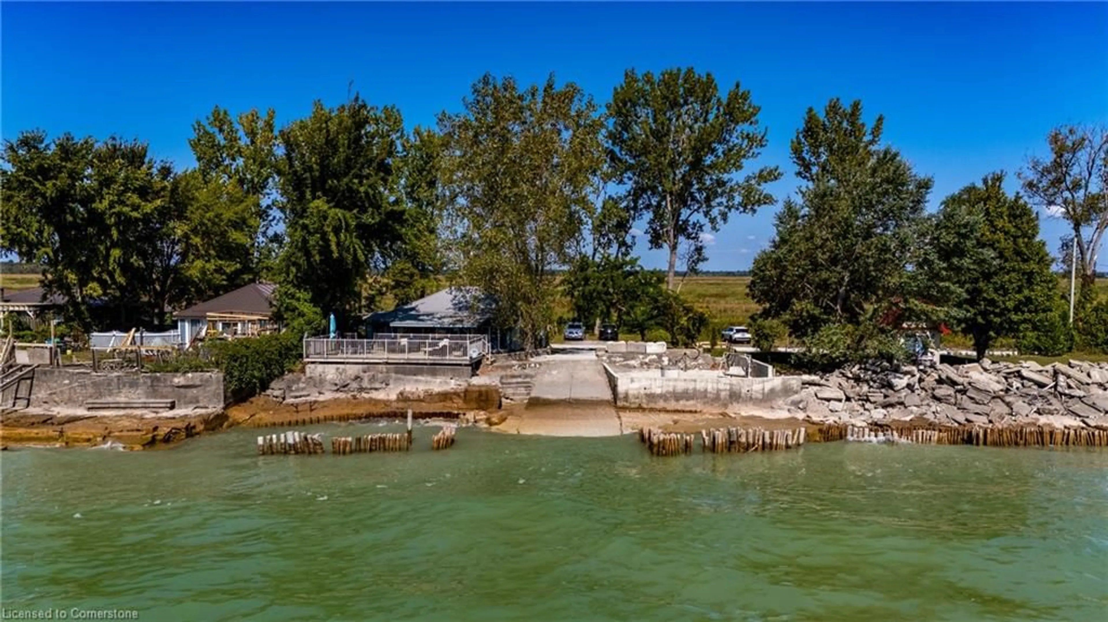 A pic from outside/outdoor area/front of a property/back of a property/a pic from drone, water/lake/river/ocean view for 205 Hastings Dr, Long Point Ontario N0E 1M0