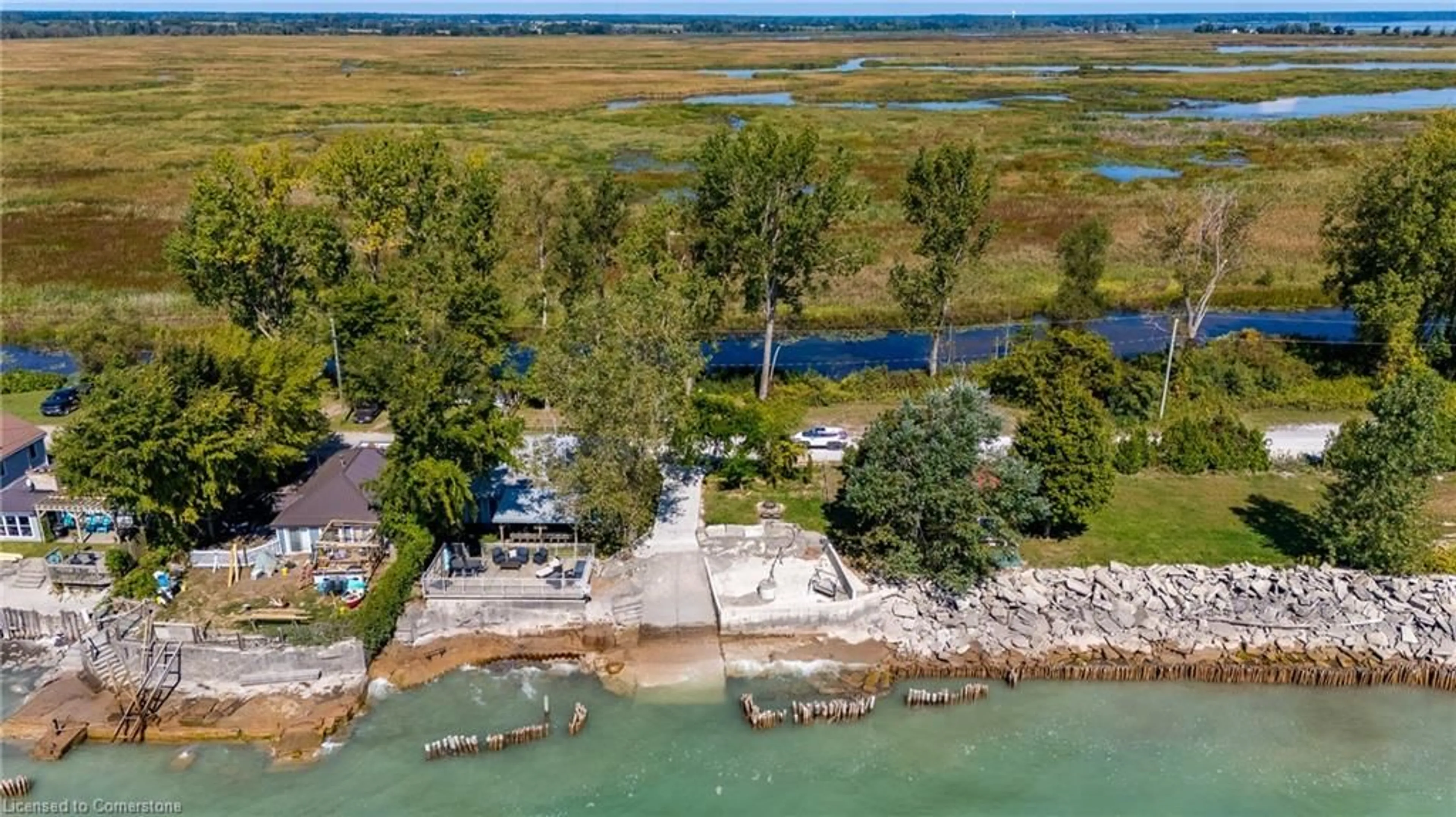 A pic from outside/outdoor area/front of a property/back of a property/a pic from drone, water/lake/river/ocean view for 205 Hastings Dr, Long Point Ontario N0E 1M0
