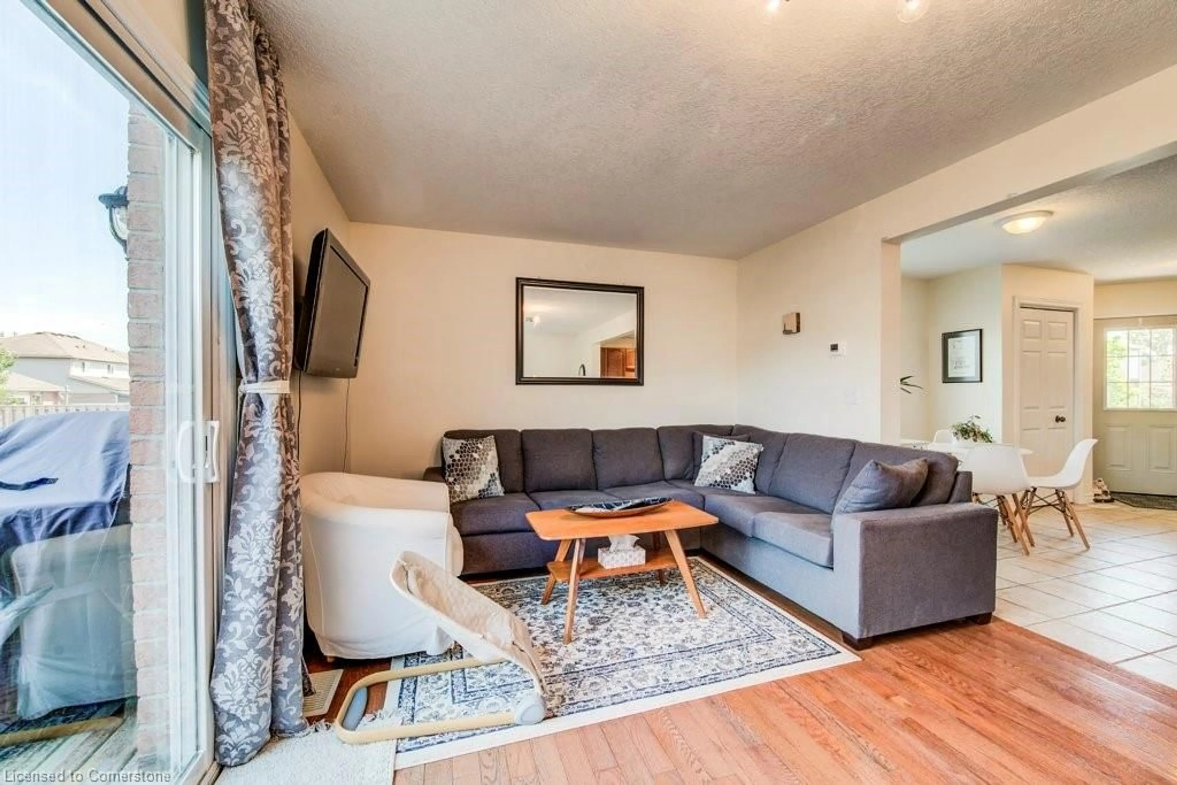 Living room with furniture, wood/laminate floor for 457 Danby St, Listowel Ontario N4W 0A5
