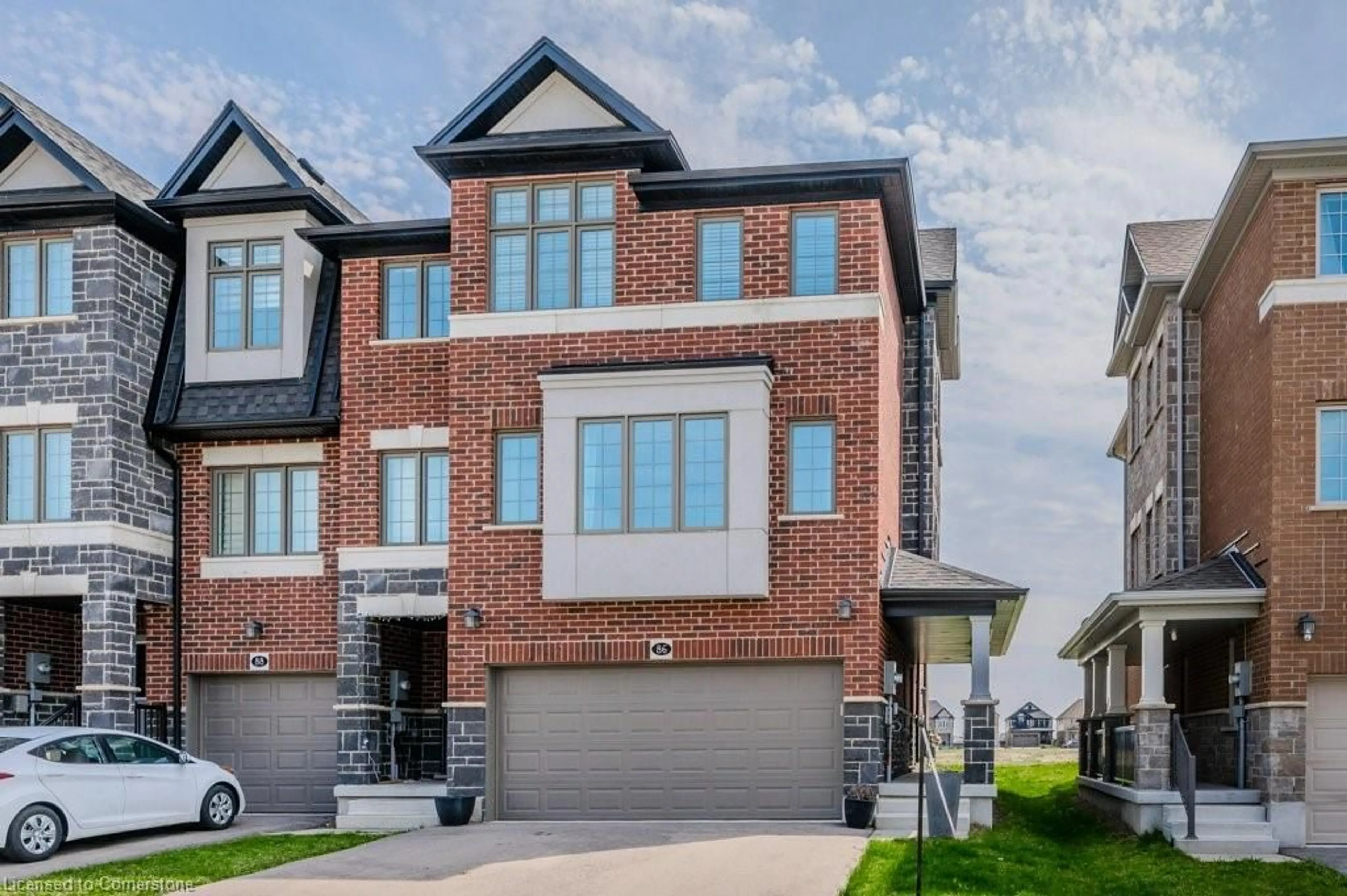 Home with brick exterior material, street for 86 Monarch Woods Dr, Kitchener Ontario N2P 0K1