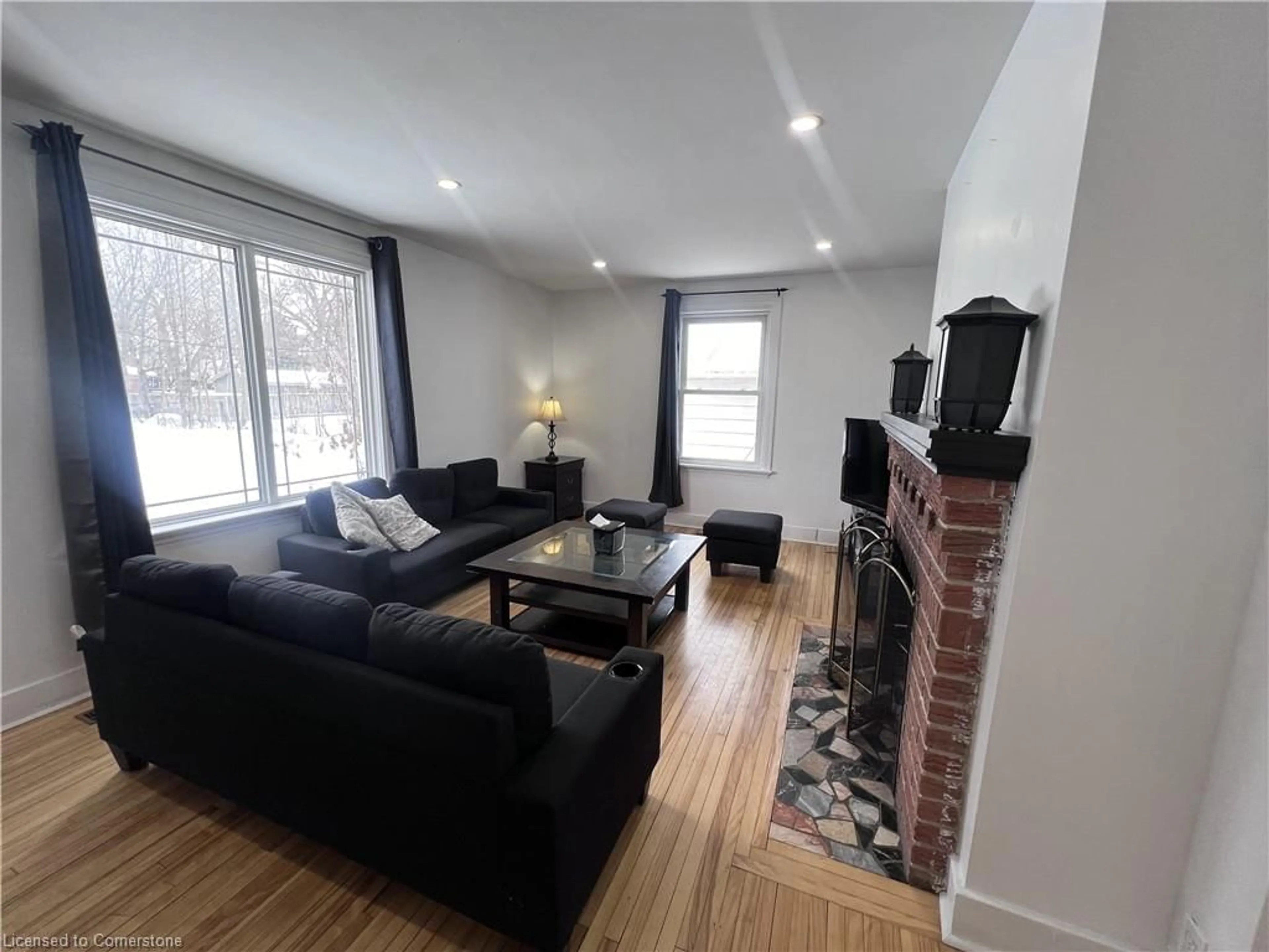 Living room with furniture, wood/laminate floor for 280 King George Rd, Brantford Ontario N3R 5L6