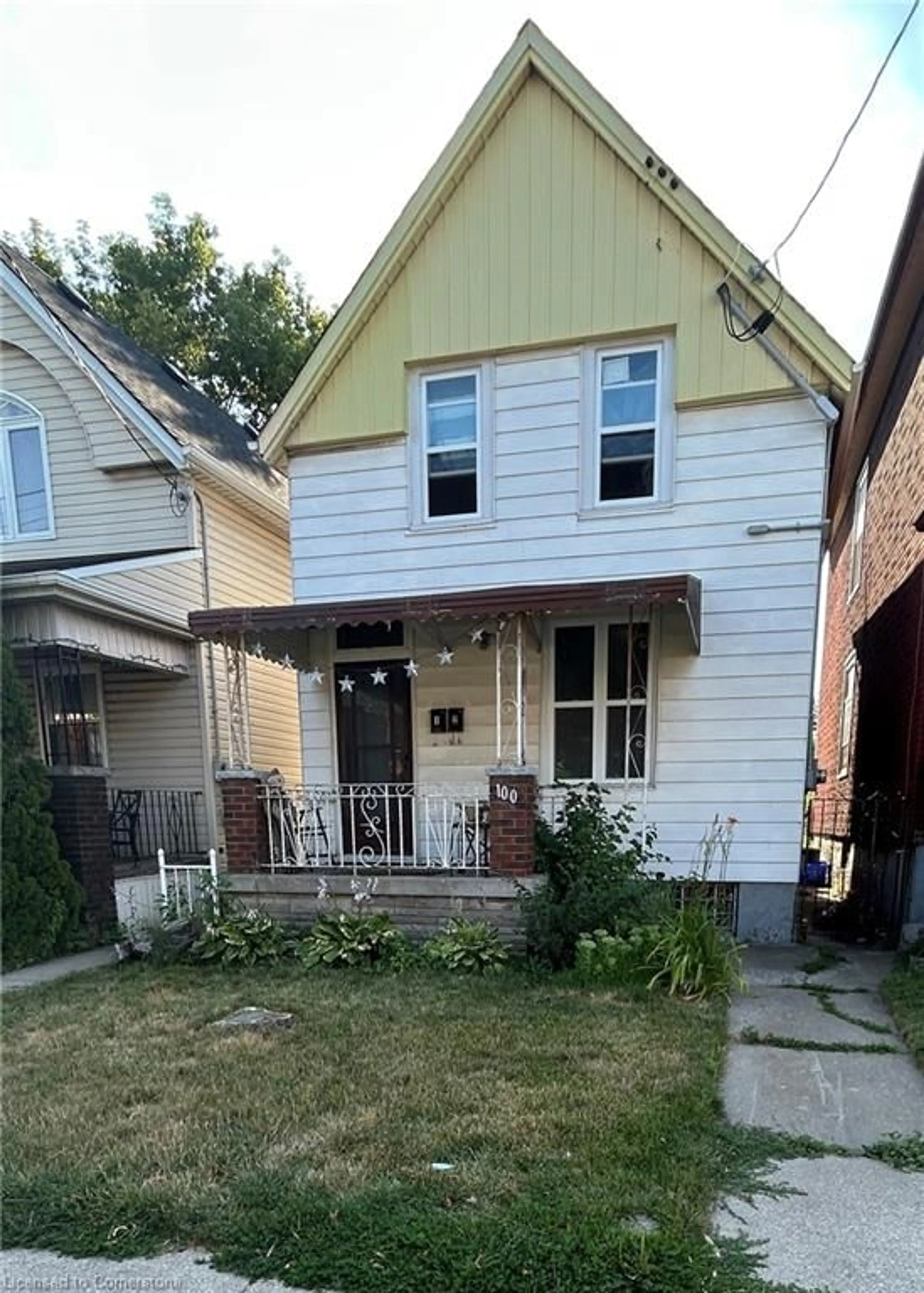 Home with brick exterior material, street for 100 Sherman Ave, Hamilton Ontario L8L 6M5