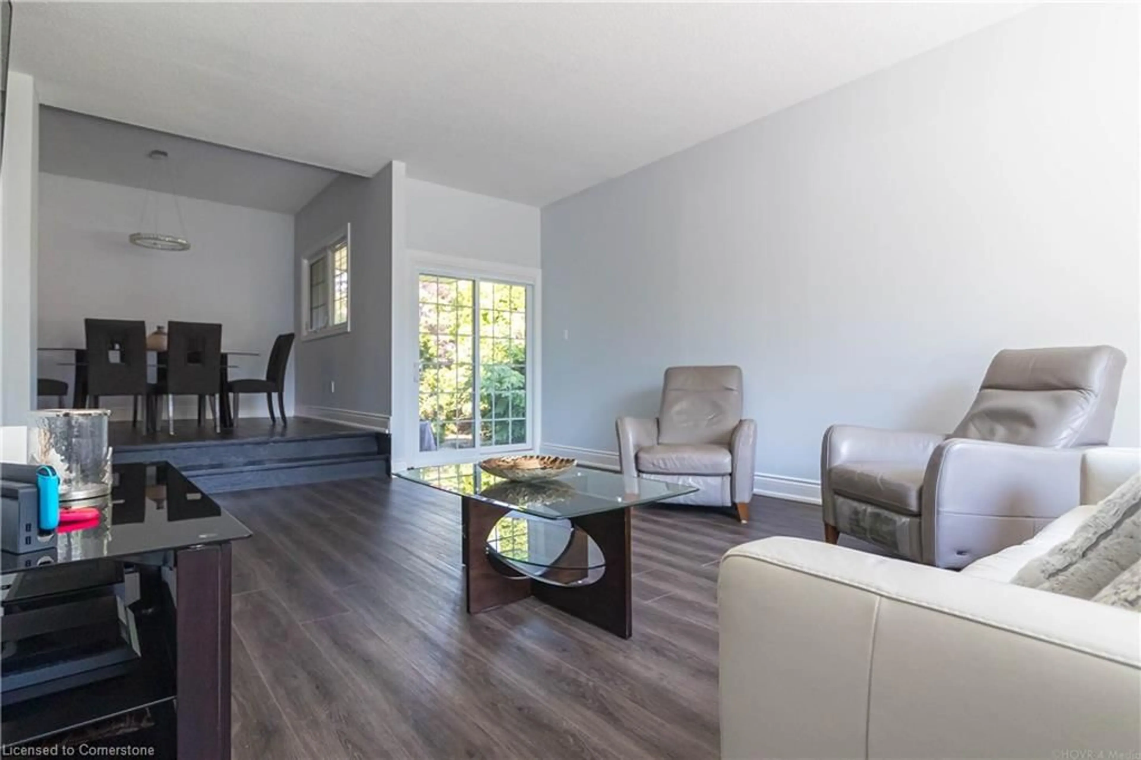 Living room with furniture, wood/laminate floor for 2390 Sinclair Cir, Burlington Ontario L7P 3C3